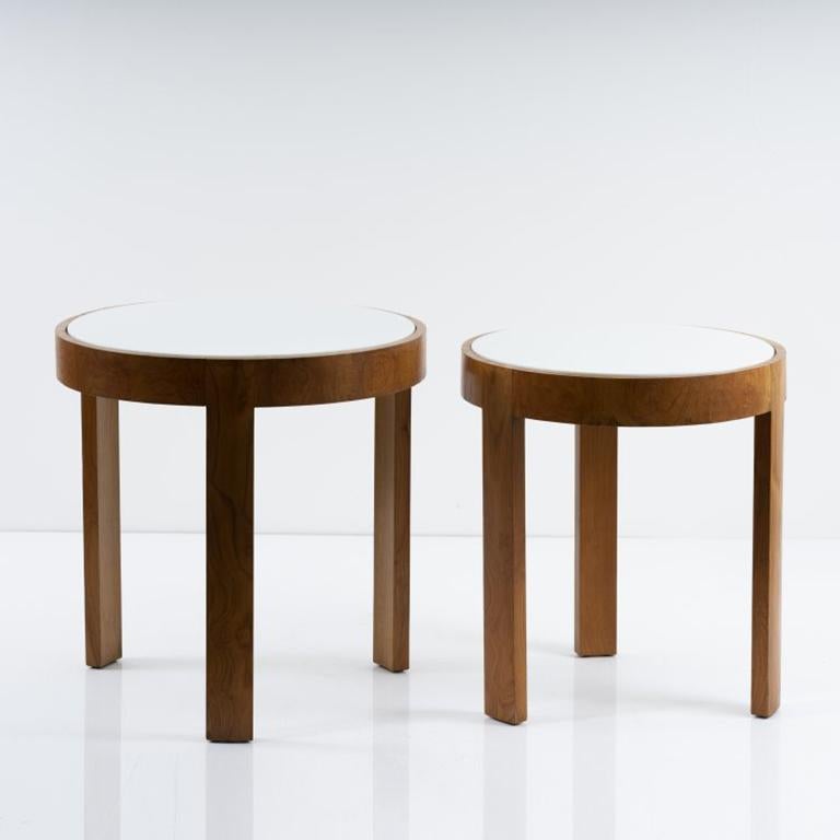 Eckart Muthesius (attributed) nesting tables, circa 1931.
Materials: Walnut and walnut veneer. Glass top.
Dimensions: H 59 cm, D 52.5 cm, H 61.5 cm, D 61 cm.
Similar model featured in Reto Niggl, “Der Palast des Maharadschas in Indore. Architektur