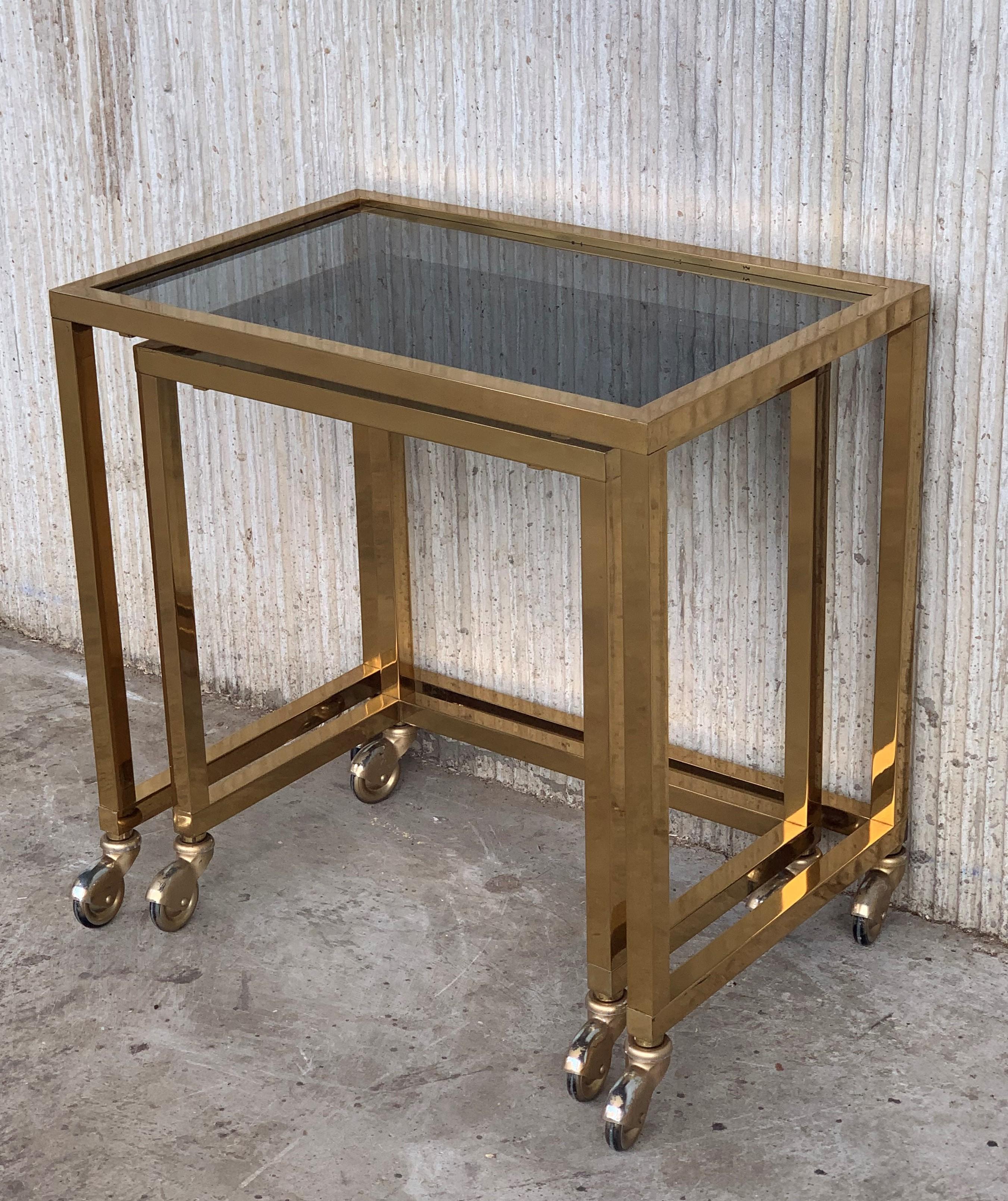 20th Century Pair of Nesting Tables Italian Design 1970 in Brass with Smoked Glass and Wheels For Sale