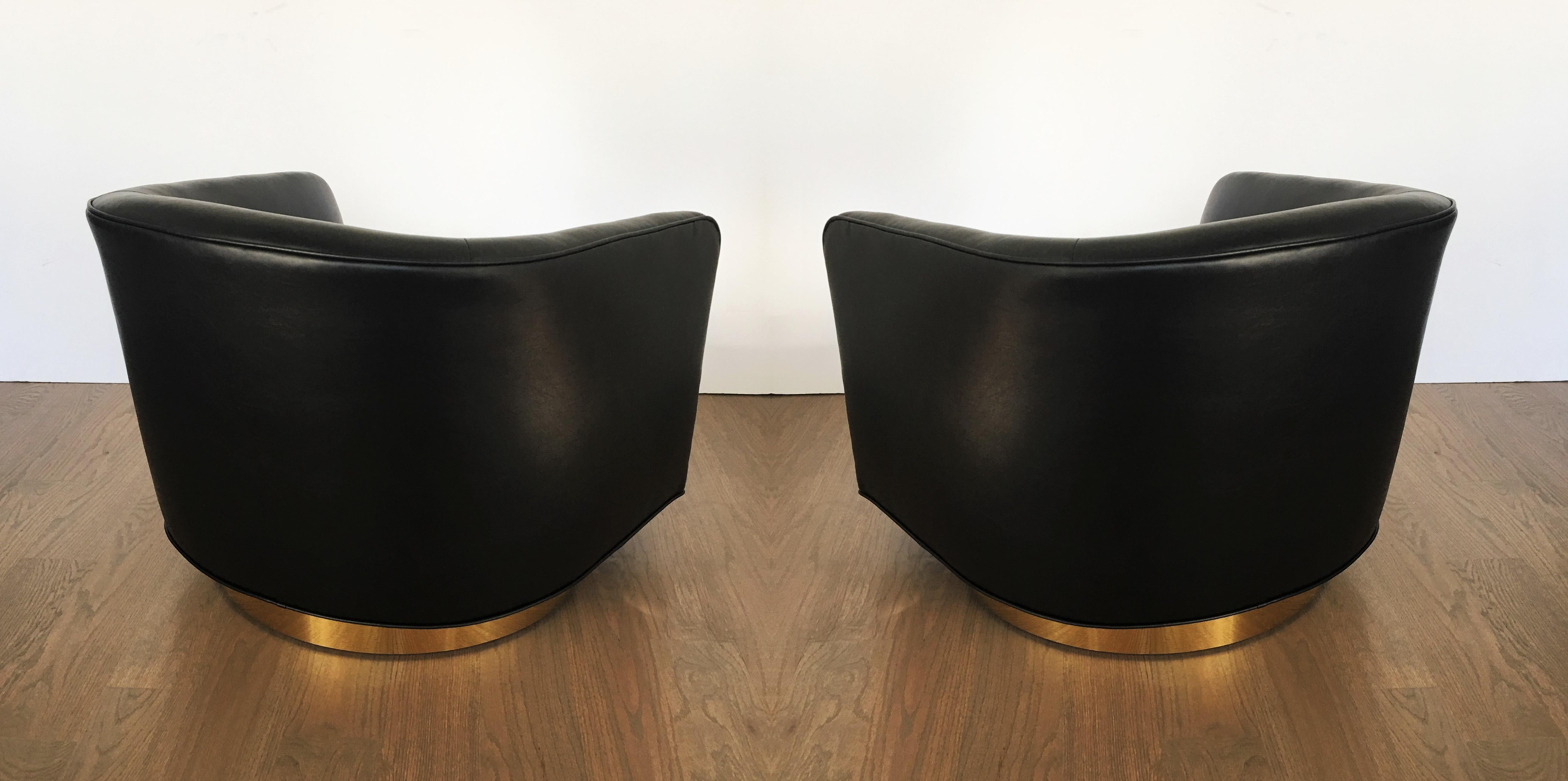 20th Century Pair of Newly Upholstered Black Milo Baughman Swivel Chairs with Brass Plinths
