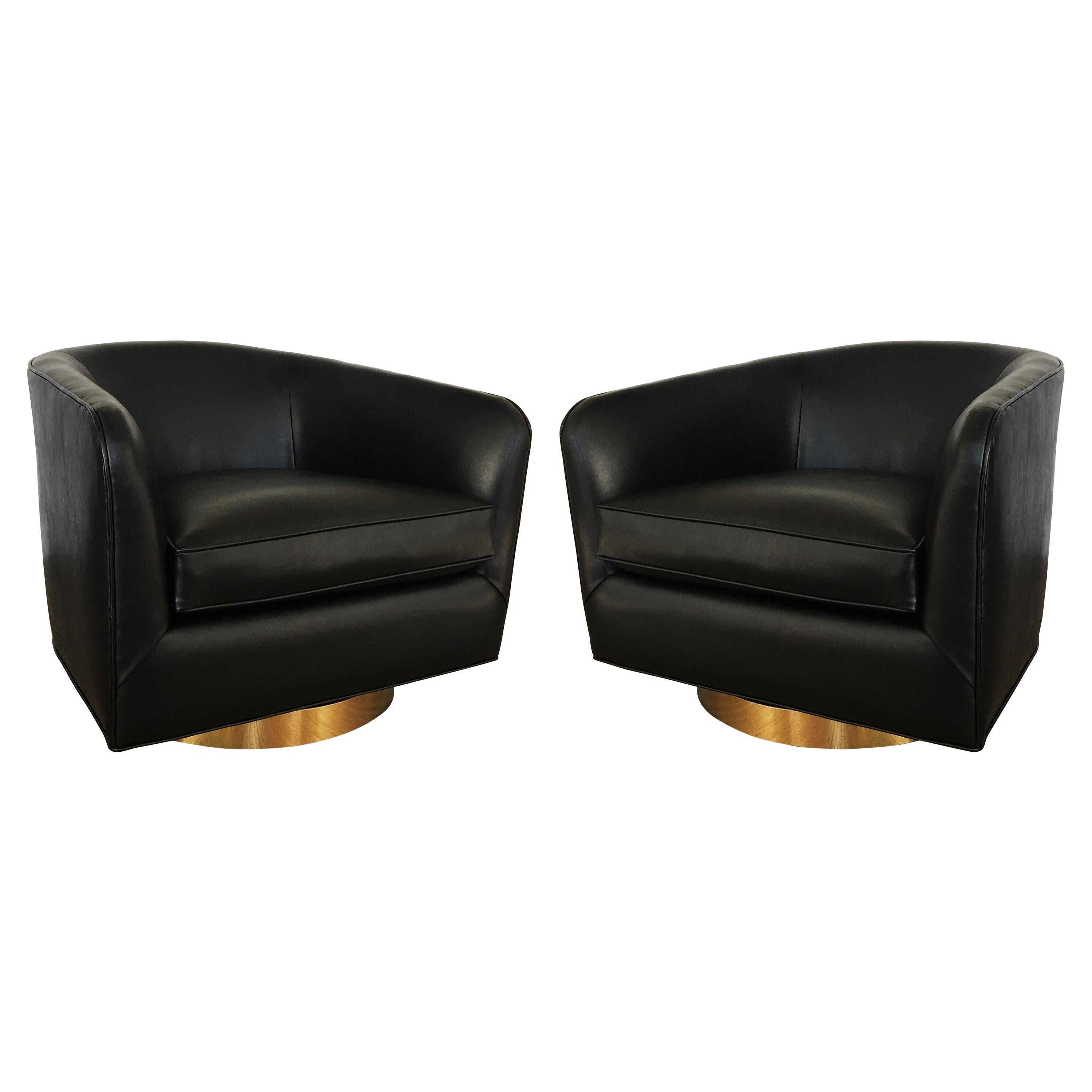 Pair of Newly Upholstered Black Milo Baughman Swivel Chairs with Brass Plinths