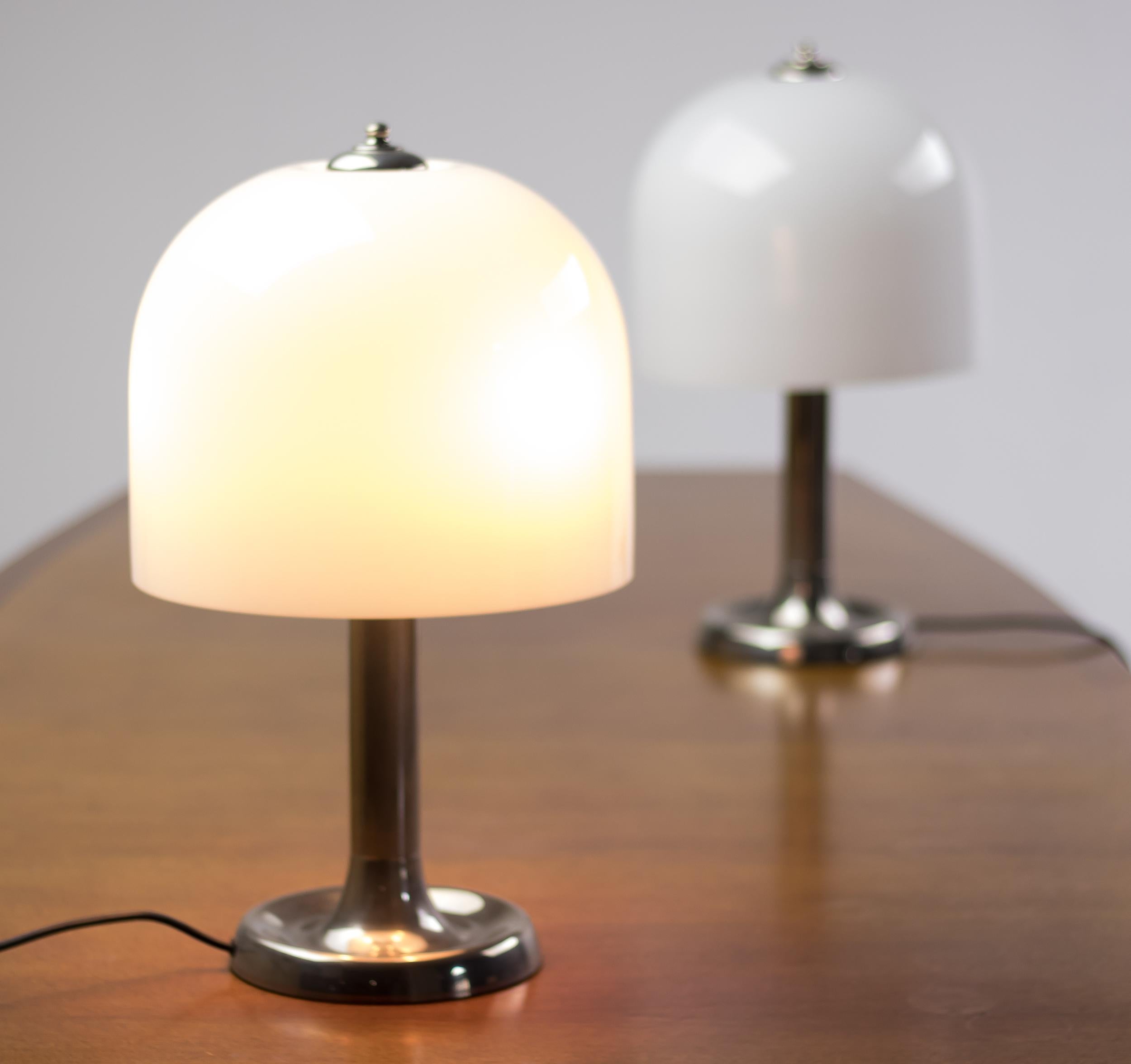 Beautiful pair of large Dutch table lamps in nickel-plated steel with opaline glass shades.