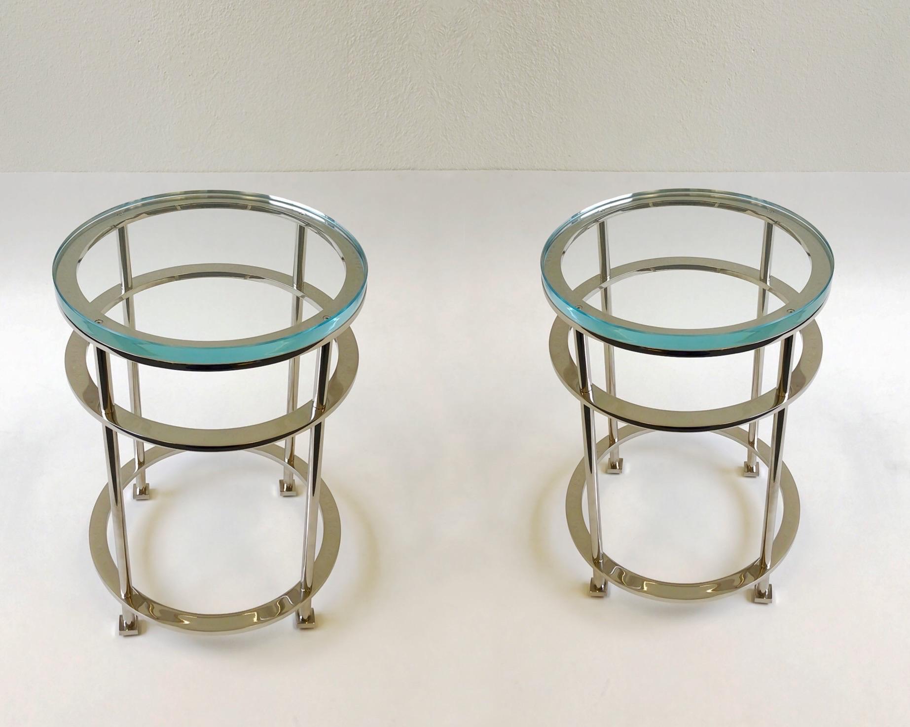 An exceptional pair of polish nickel and clear Lucite occasional tables design by French designer Jean Michel Wilmotte for Mirak in the 1980s. The tables have new 1” thick Lucite tops. The tables are solid steel that’s polished nickel
