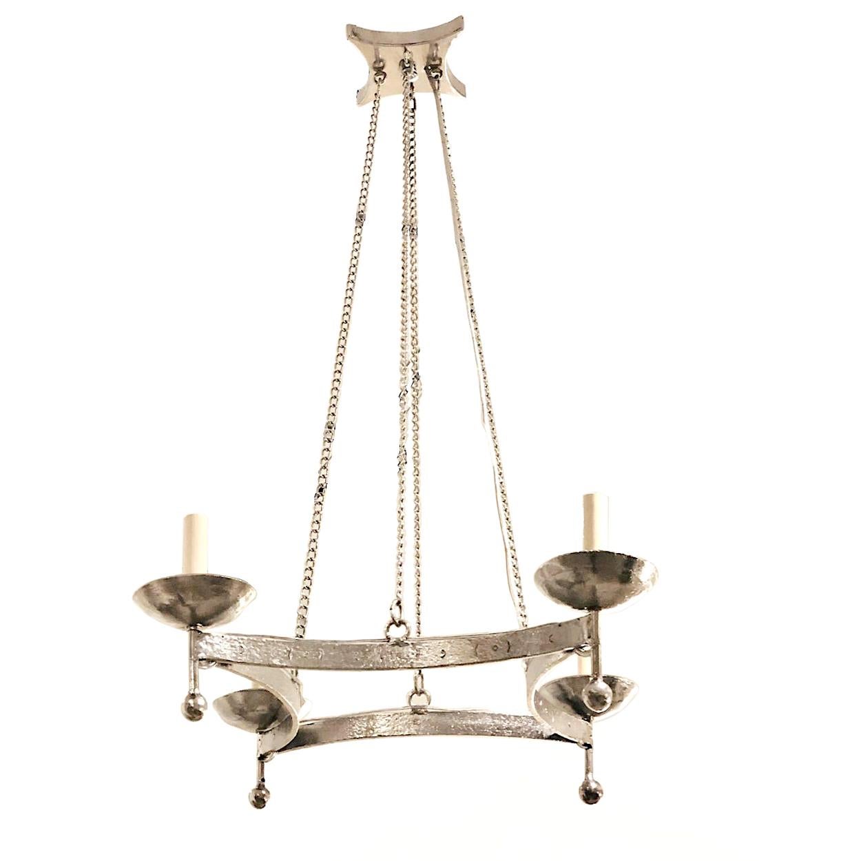 A pair of circa 1940's Italian hammered and silver plated light fixtures with 4 candelabra lights. 
Sold Individually

Measurements:
Current Drop: 35