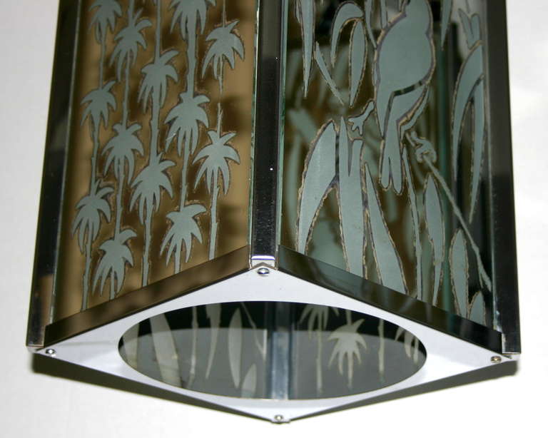 Pair of 1940s Italian nickel-plated lanterns with etched glass and mirrored panels depicting birds and palm trees. Sold individually.

Measurements:
Height (minimum drop): 27.5