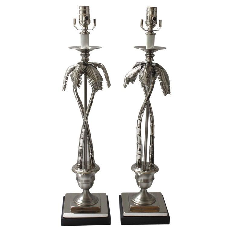 This stylish and chic pair of nickel plated palm tree-form table lamps are from Angel & Zevallos and they are very much in the manner of pieces created by Maison Jansen. The pieces are finished in a high gloss and satin finish nickel plating.