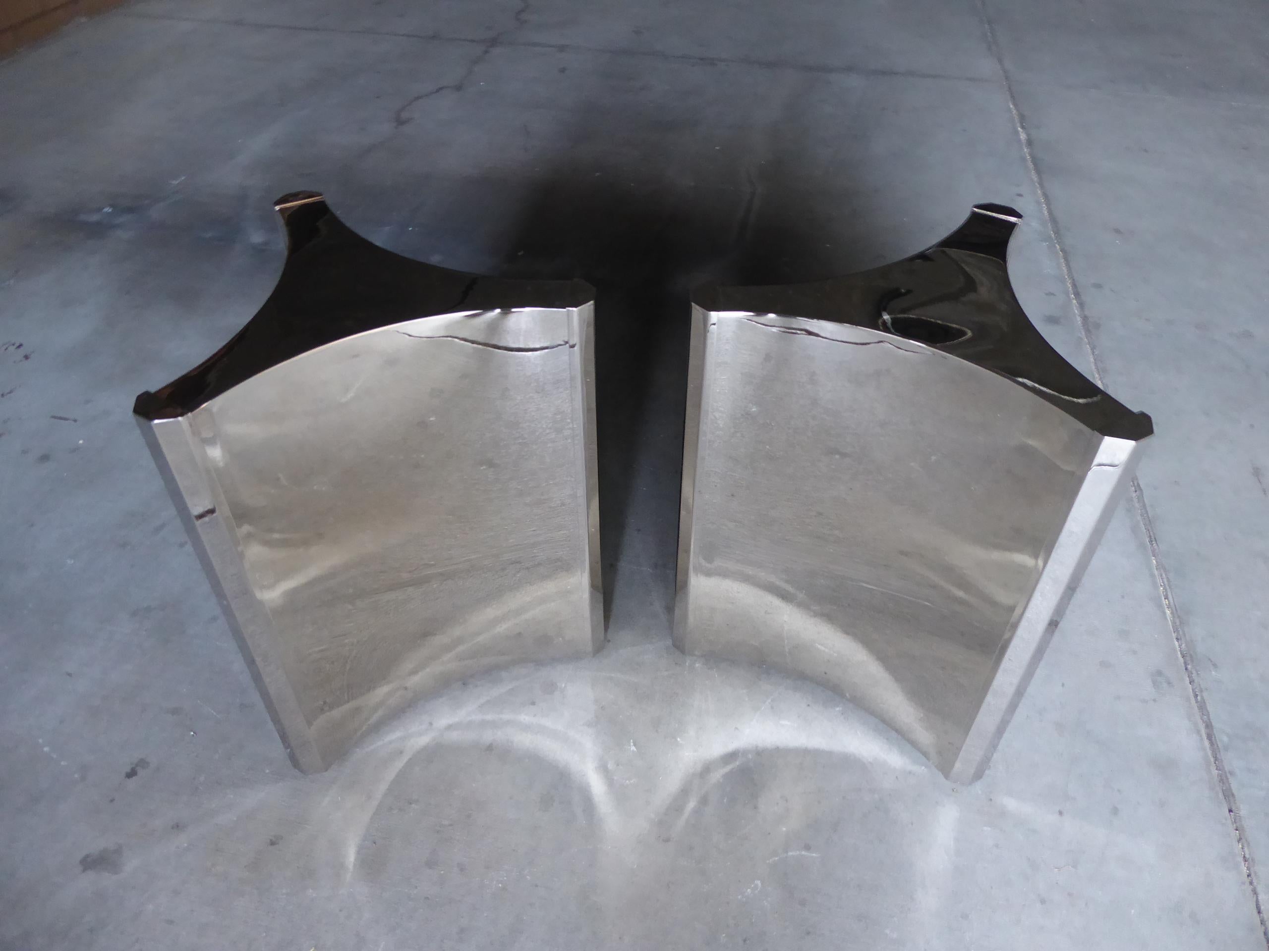 A pair of nickel-plated steel trilobi (three-sided) dining table bases made in the 1970s by Mastercraft. The bases have been recently nickel plated in a polished, mirror finish. These bases were made to hold a substantial glass top.
The dimensions