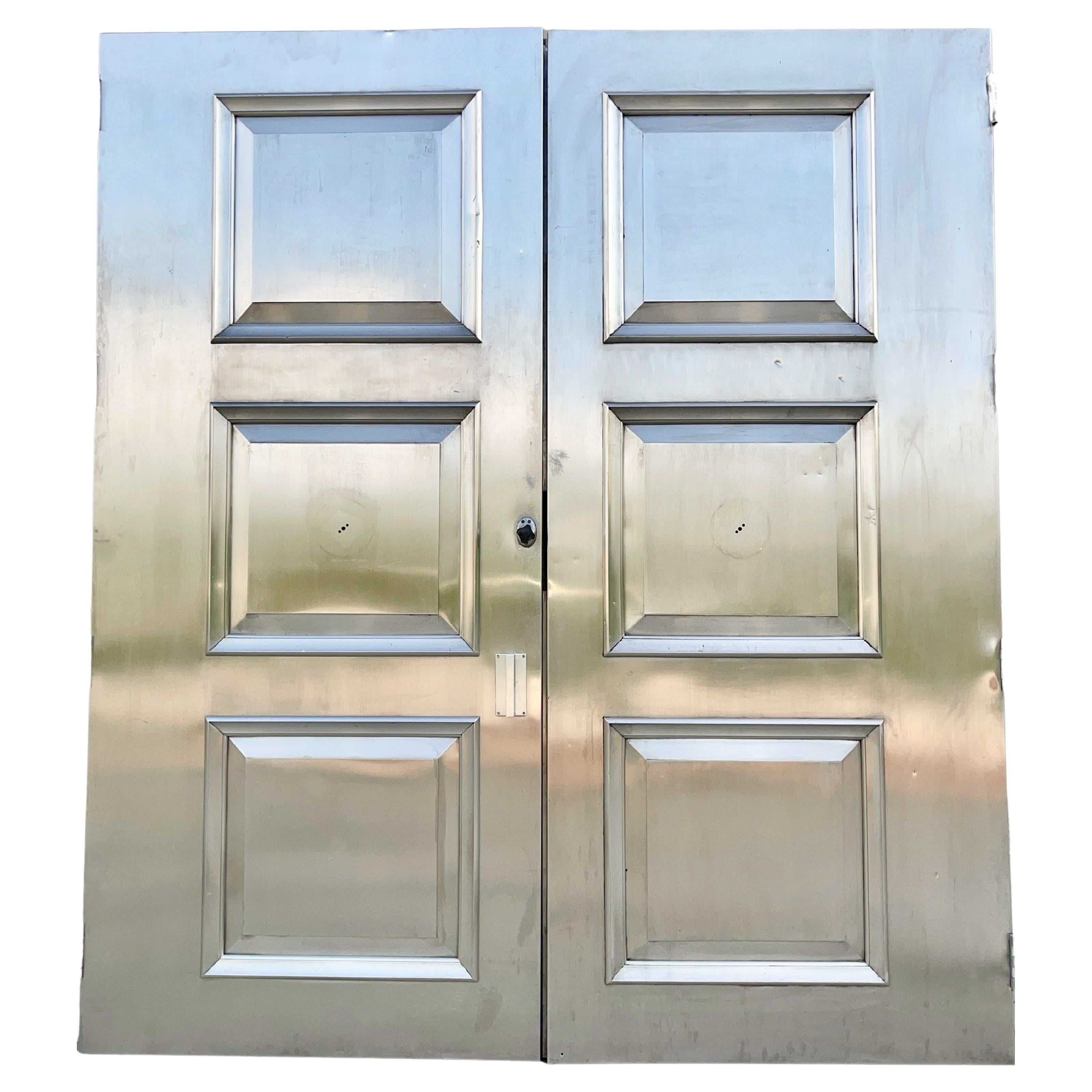 Pair of Nickel Silver Three Paneled Double Doors