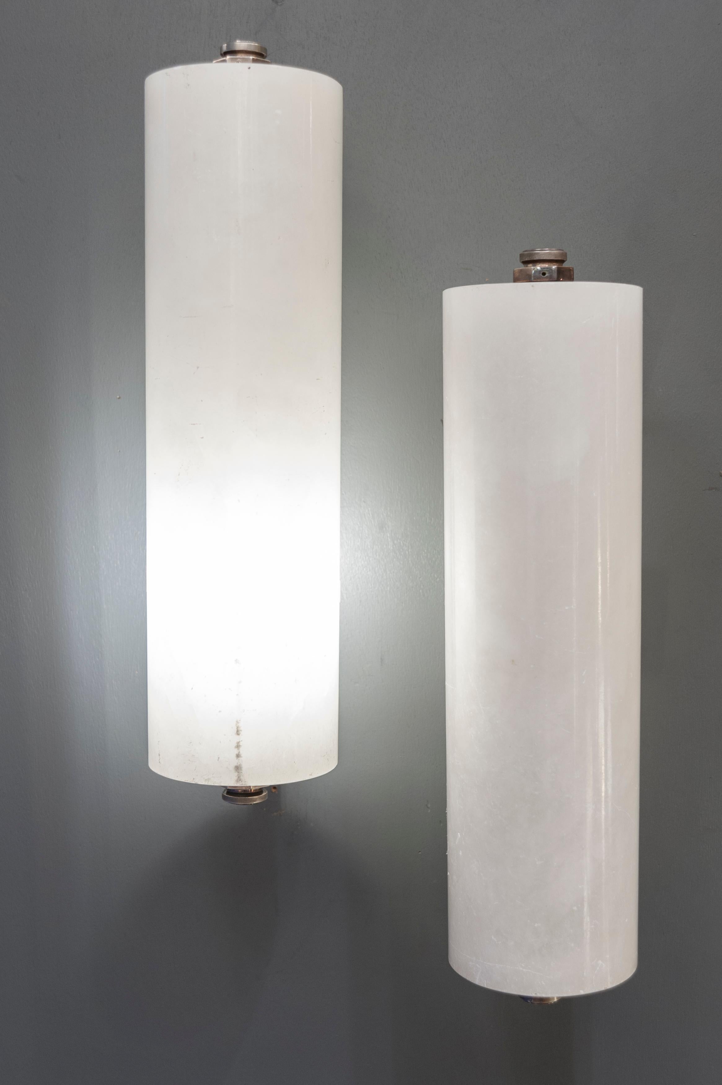 Pair of Art Deco style wall sconces, made of nickeled bronze structure and rotating alabaster cylinder.