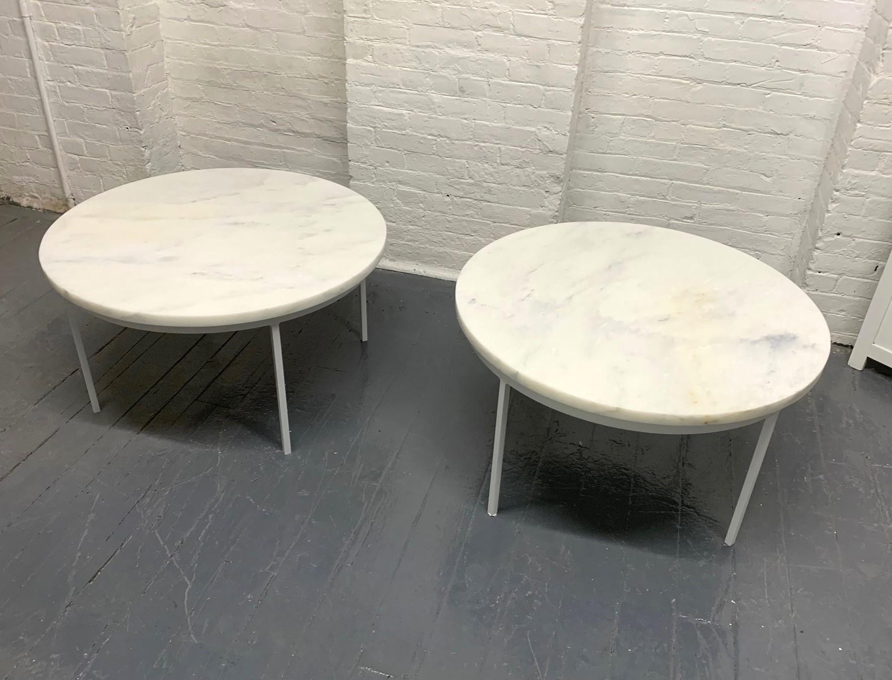 Pair of Nicos Zographos Style Carrara marble-top tables. The base is white painted iron with a one-inch thick Carrara marble top.