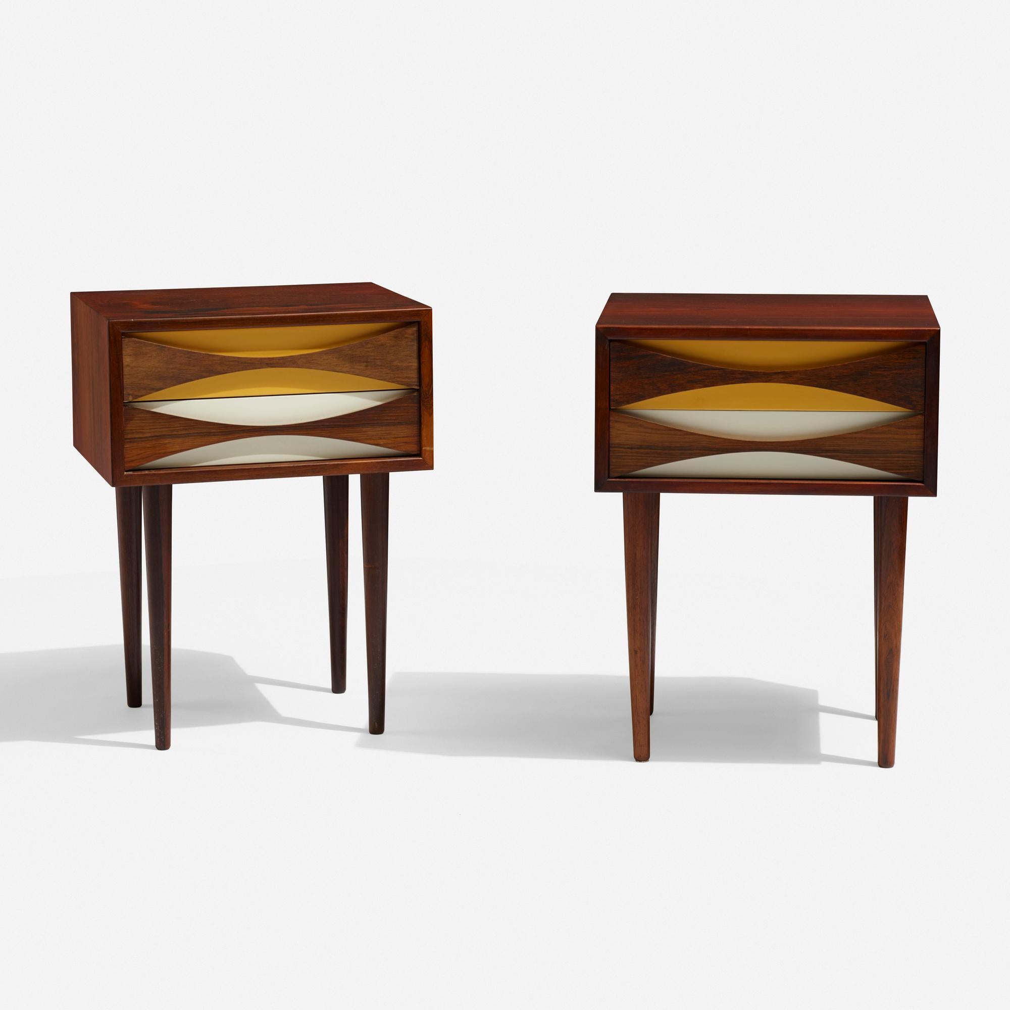 Pair of elegant Niels Clausen nightstands/side tables.
Each nightstand features two drawers.
Rosewood, lacquered wood.