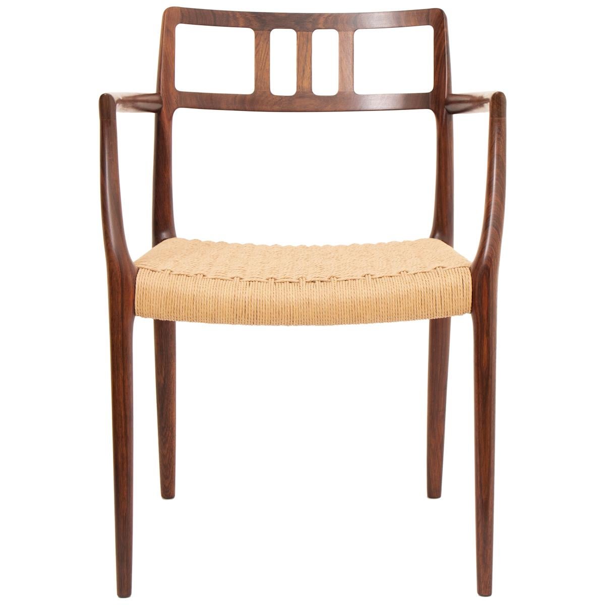 A rare, highly-desirable, elegant, highly sought after and difficult to source in such great condition, pair of Niels Møller for rosewood carver dining chairs. Model 64, which was designed by Niels Møller in 1966. Manufactured from solid Rosewood