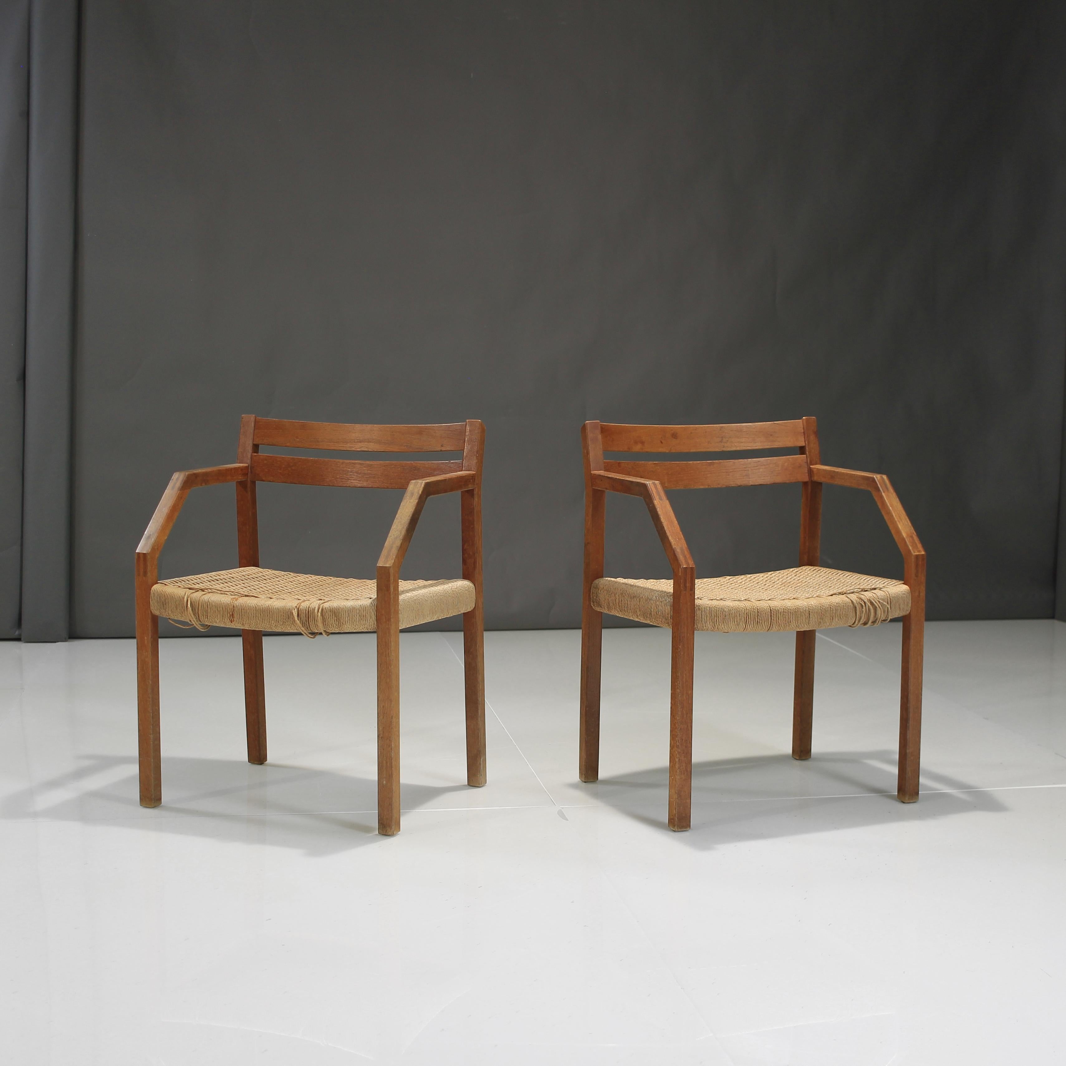 Beautiful pairing of Niels Otto Moller Model 404 Armchairs in Teak and Papercord.

Chairs are structurally sound.  Papercord has a few strands cut at ends.  The seats are otherwise in great condition, can be sat in no problem and can be used safely