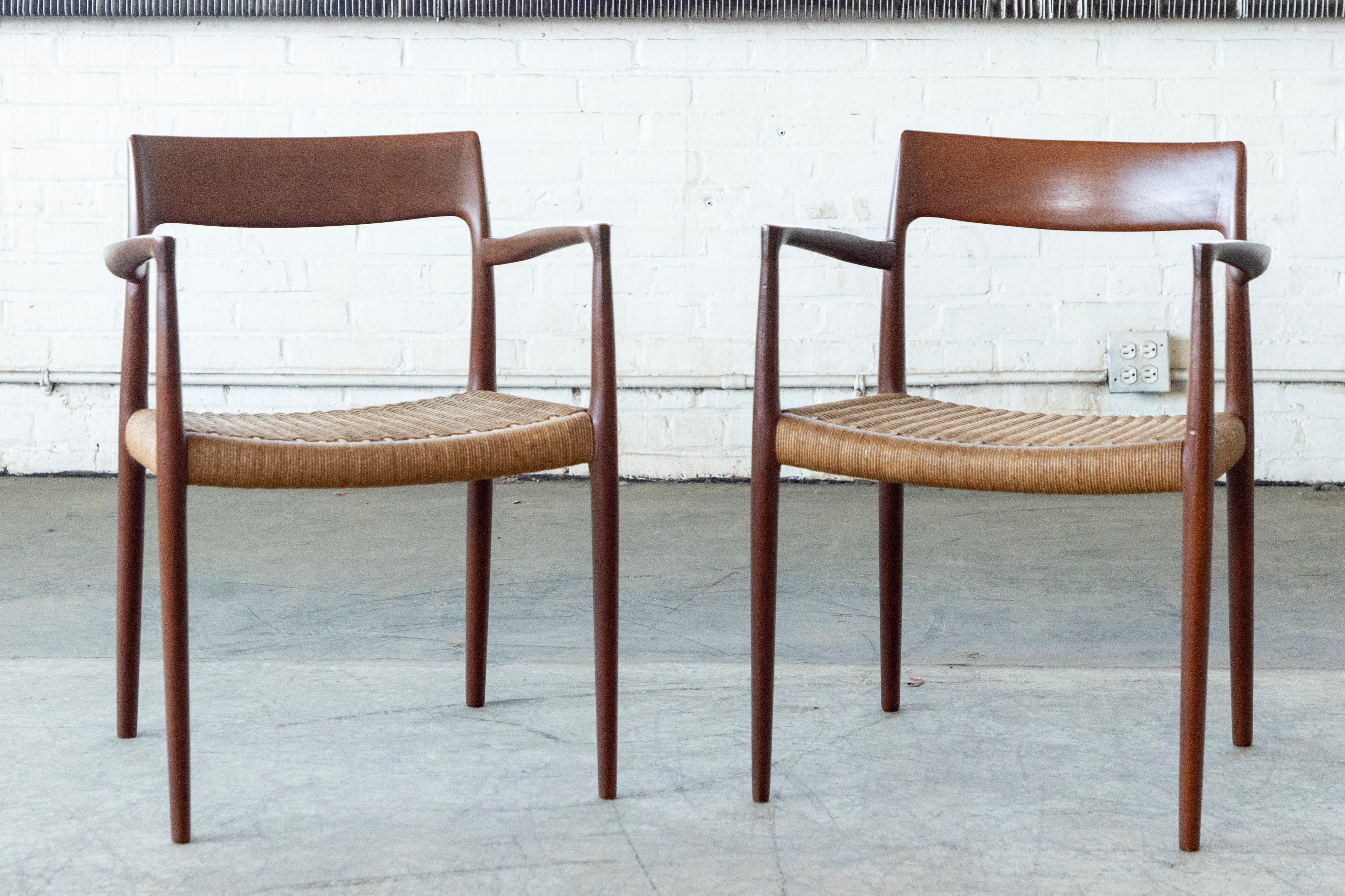 This wonderful Danish modern teak armchair by NO Moller was designed in 1950's for J.L. Møllers Møbelfabrik. The chairs retain the original paper cord in very good condition. A truly classic midcentury Danish design to upgrade any room. Signed with