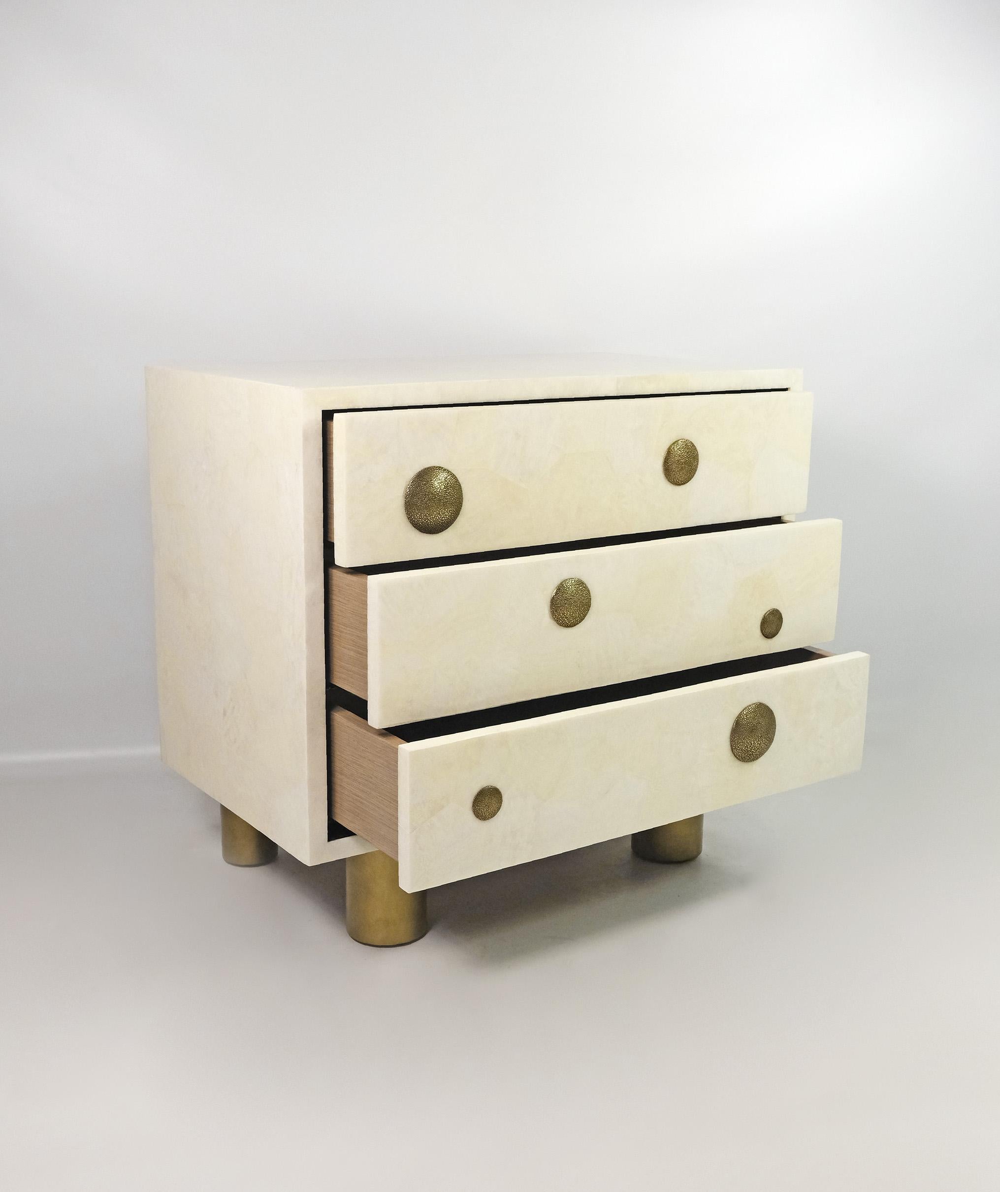 French Pair of Night Stands in White Rock Crystal with bronze decor by Ginger Brown For Sale
