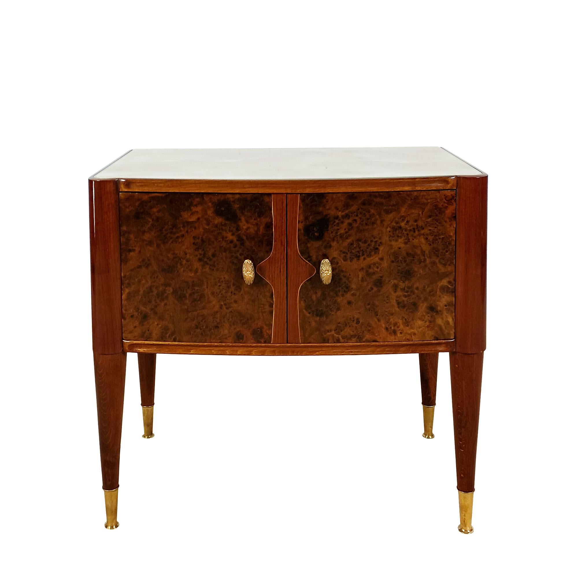 Pair of solid mahogany night stands with mahogany and burl walnut veneer and lemon tree rodss on the doors, imitation marble glass on top (minor defects), polished brass handles and feet. French polish.

Italy circa 1940