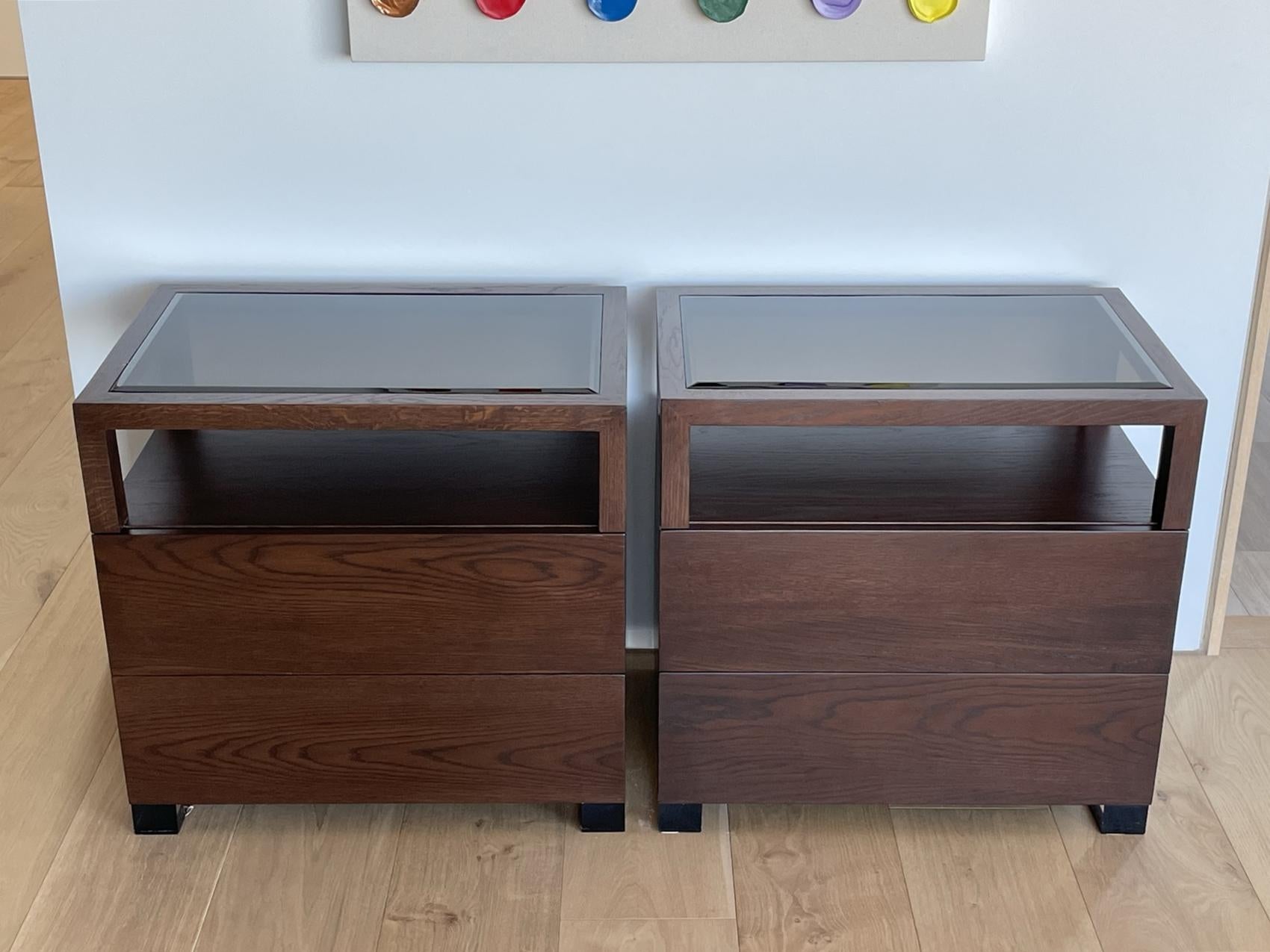 Beautiful pair of nightstands made of solid white oak with bronzed lucite legs and tops.

The pieces have beautiful lines and great presence, they are solidly built and crafted locally.

The nightstands come with two drawers for storage and it also