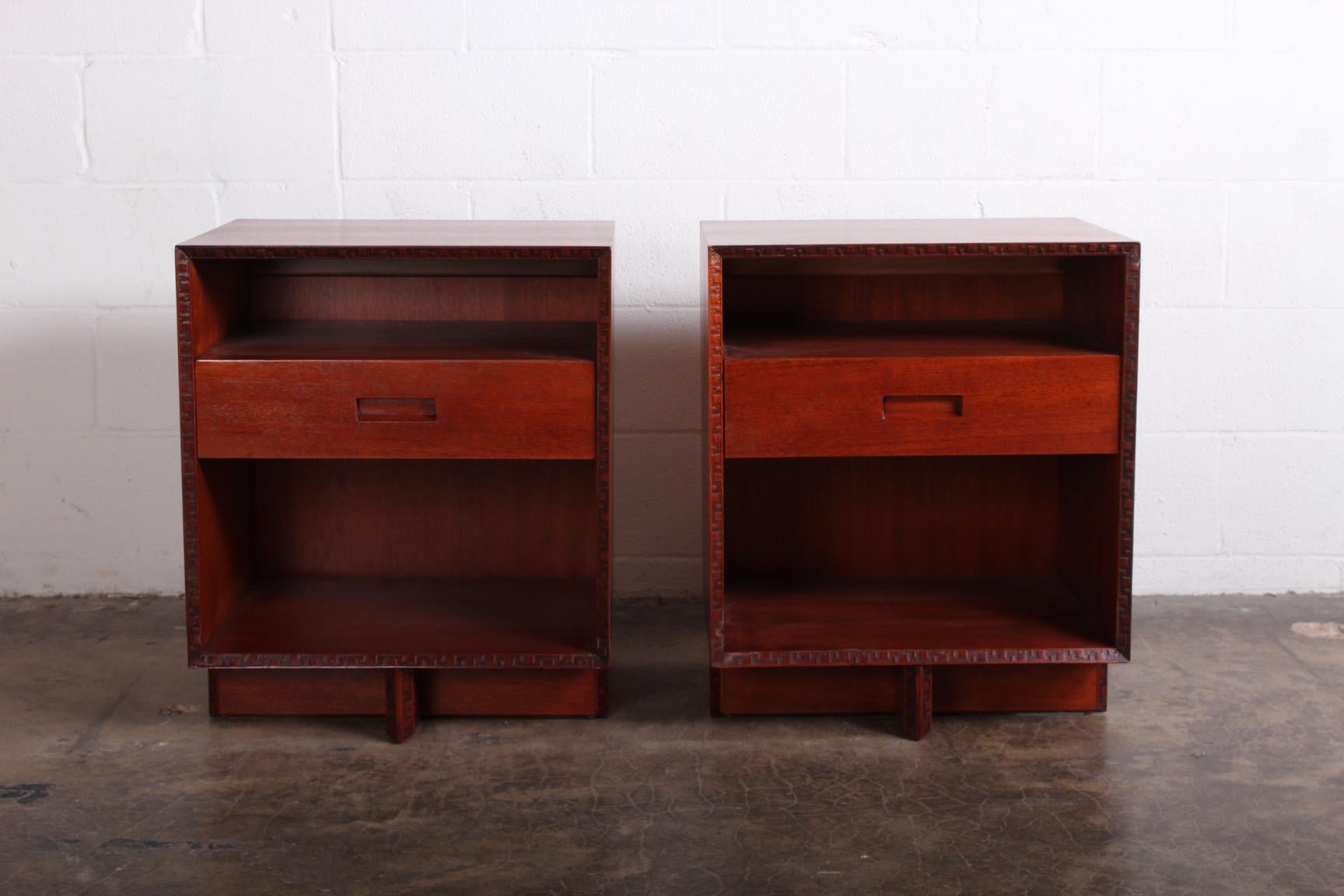 A pair of mahogany nightstands designed by Frank Lloyd Wright for Henredon.