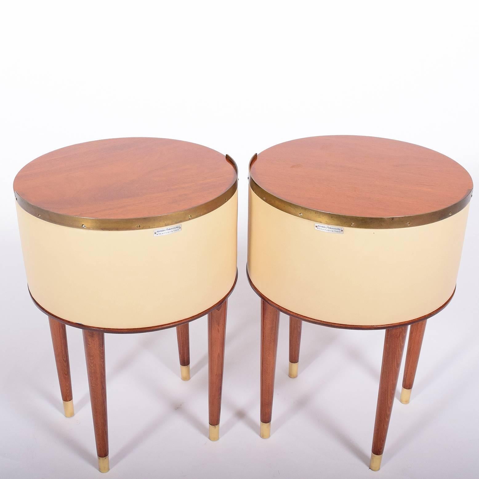 Pair of mahogany brass and vinyl tables/nightstands designed by Halvdan Pettersson in the 1950s for Tibro Möbelfabrik.