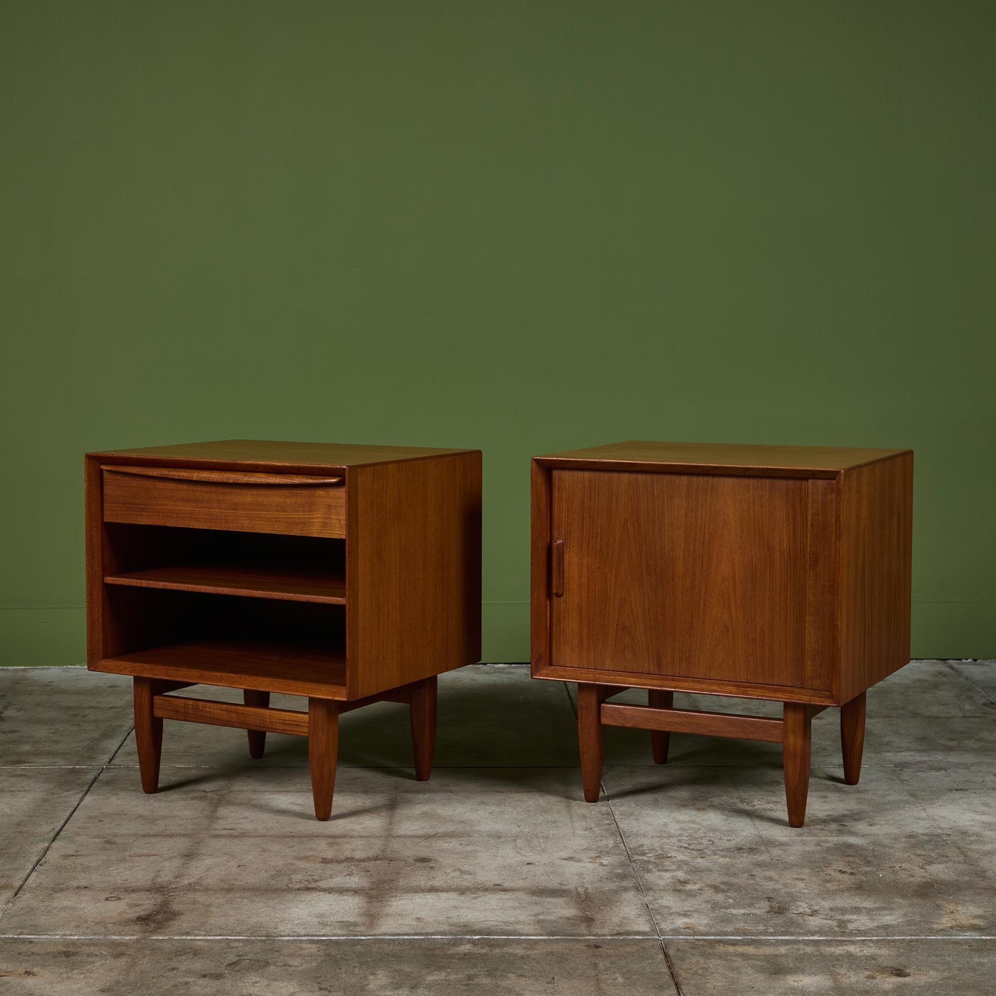Pair of nightstands by Svend A. Madsen for Falster, c.1960s, Denmark. The teak nightstands each feature a different front. One has two open shelves and a drawer at the top, while the other has a gorgeous tambour door with two concealed shelves and a