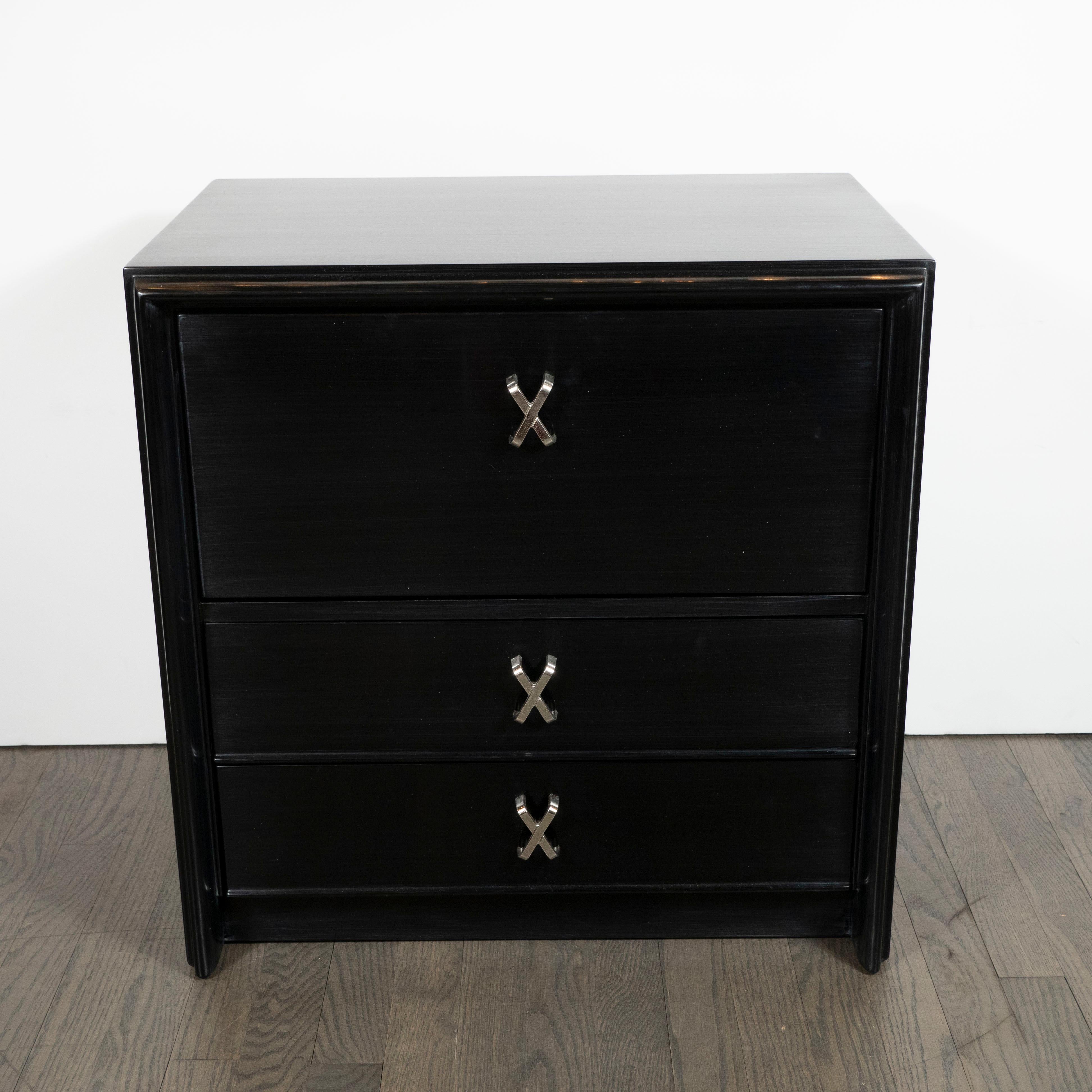 This elegant pair of Mid-Century Modern night stands were designed by the celebrated 20th century designer Paul Frankl and handcrafted in the United States for John Stuart Inc., circa 1960. They feature a hand-rubbed, ebonized finish throughout with