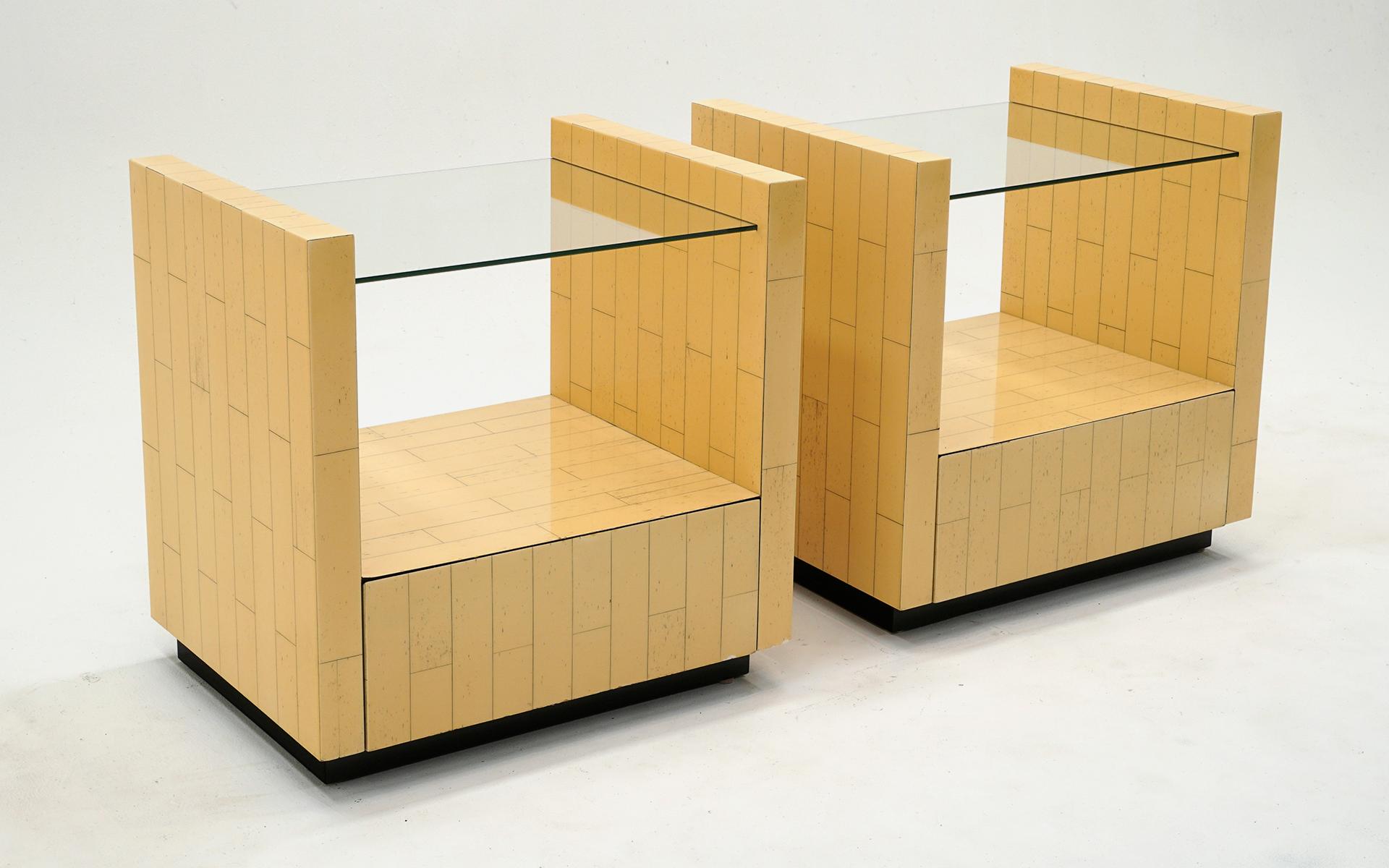 Pari of Karl Springer bed side tables / night stands / end tables with drawer.  Wood cases with ink.  New glass inserts.  Very good condition and ready to use