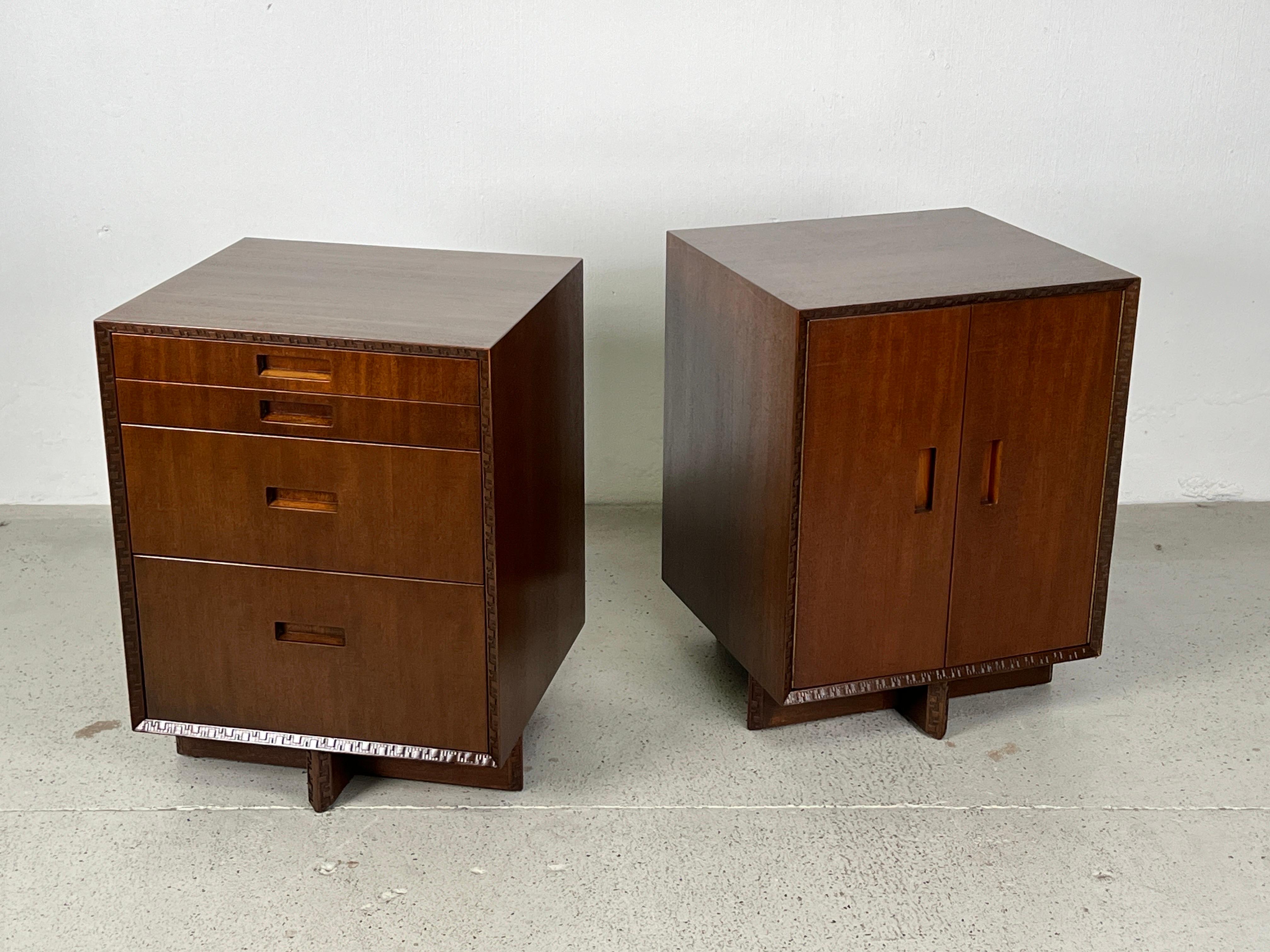 A pair of mahogany chests or nightstands designed by Frank Lloyd Wright for Henredon.