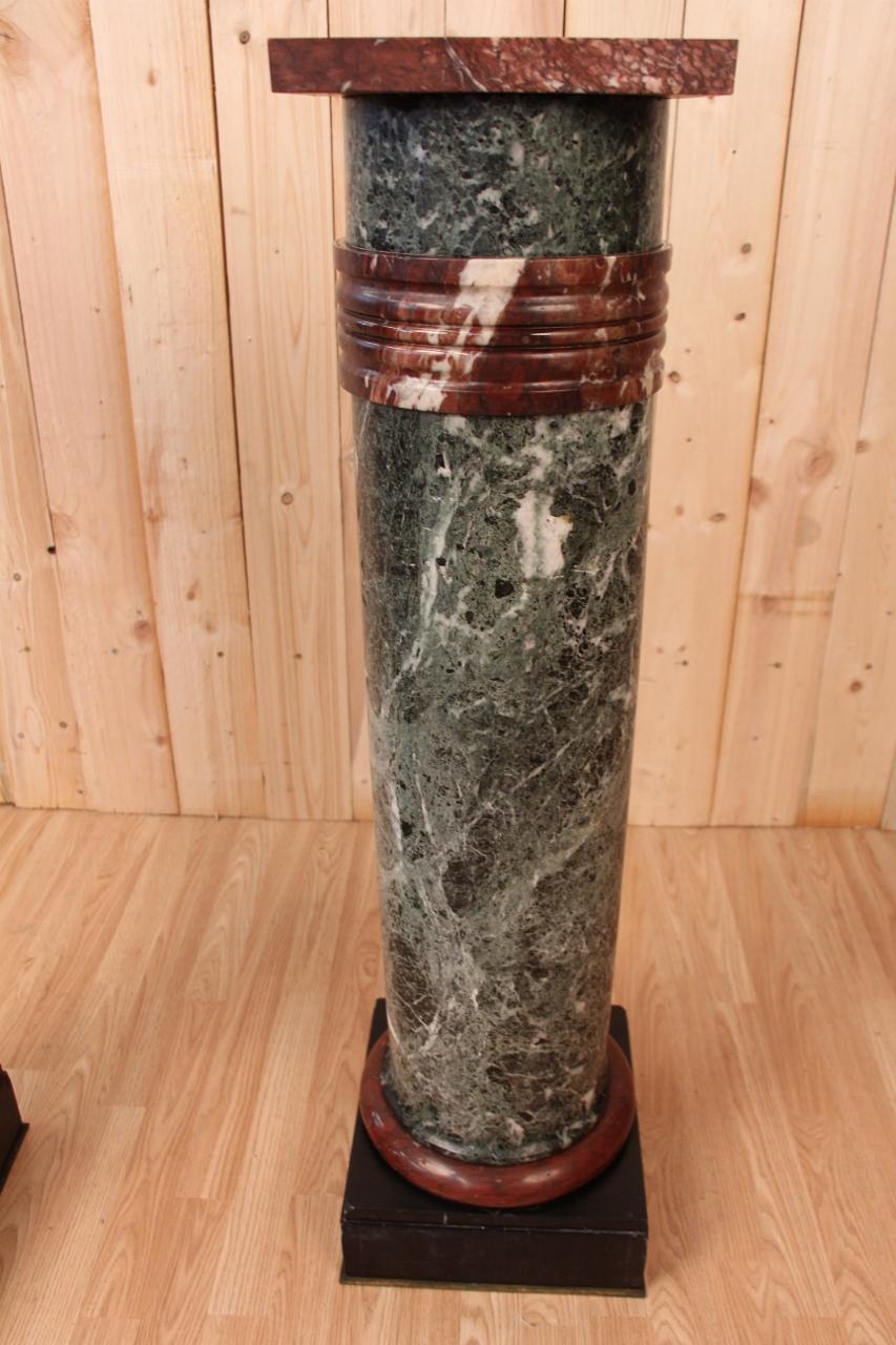 pair of sea green and cherry red marble columns, XIXth century overall in good condition, some small lack of use on the lower angles and restorations of uses size of the lower base: 32 cm by 32 cm size of the upper base : 28 cm by 28 cm each column