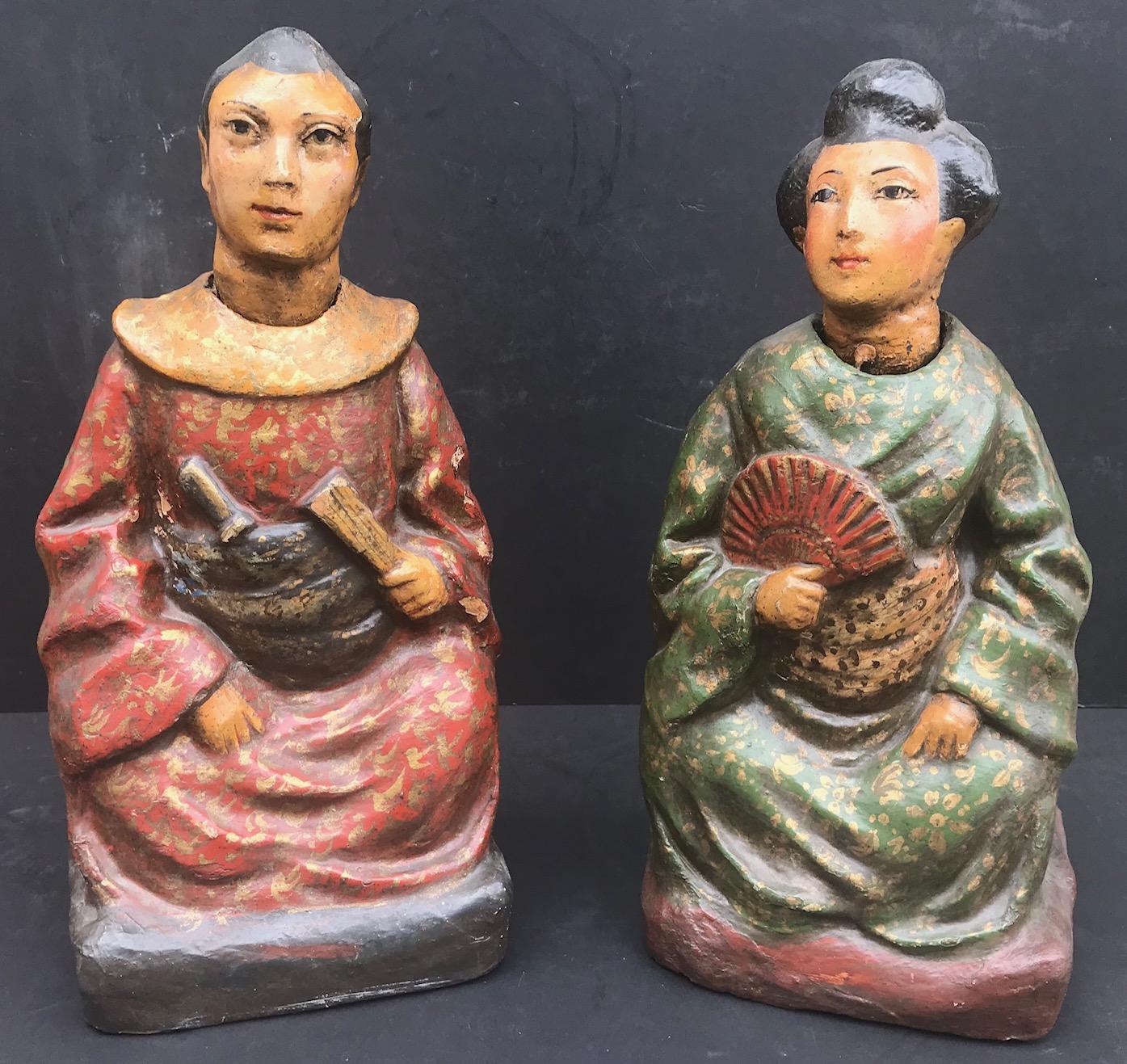 These two figures, male and female, are made for the British market. They wear traditional Chinese robes with elaborate original polychrome decoration. Both heads nod in different directions. The vast majority of nodding head figures was imported