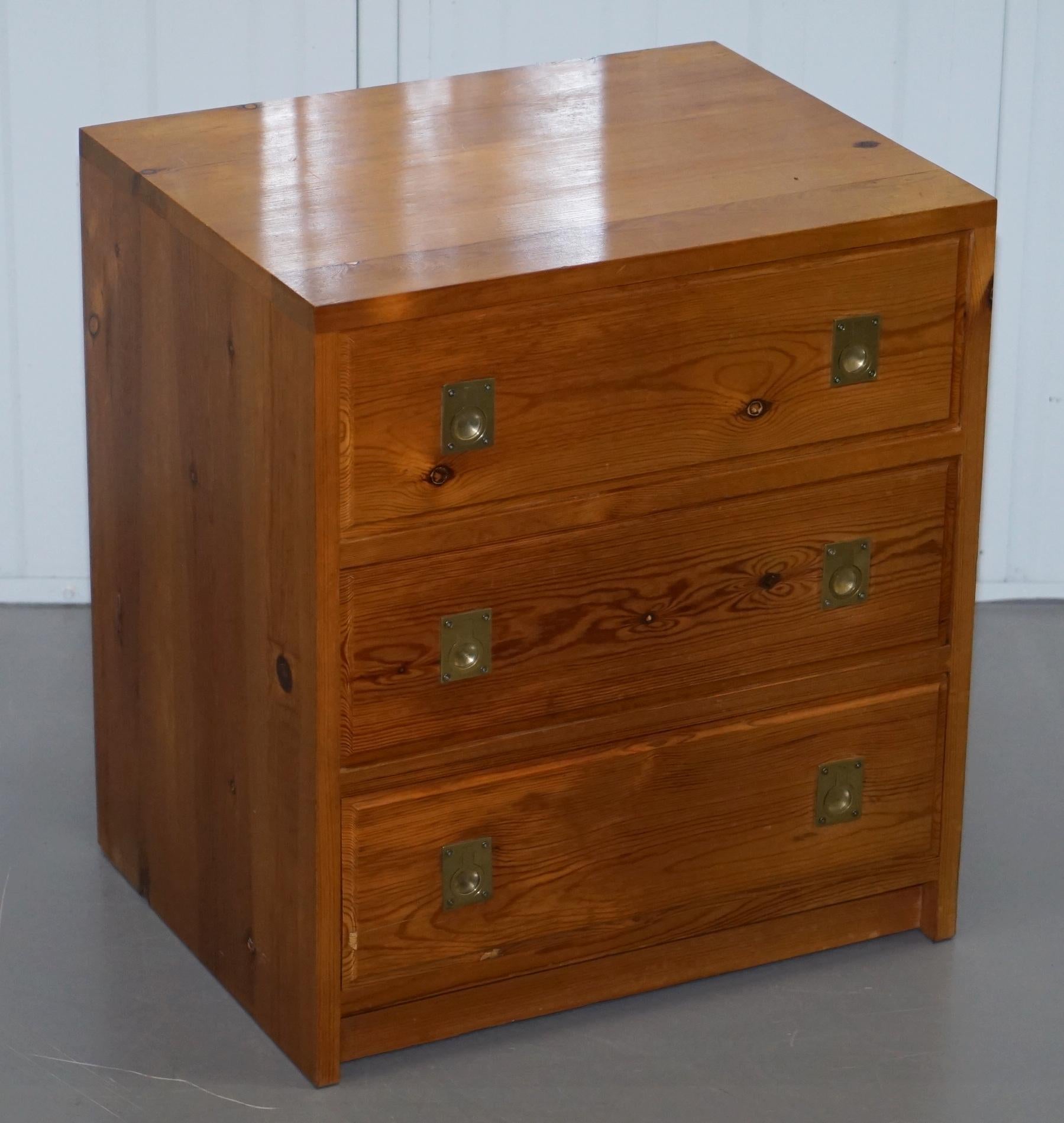 We are delighted to offer for sale this stunning pair of Nodus solid pine campaign bedside table sized chests of drawers

A good looking pair with a lovely burr pine timber and solid brass fittings, the pictures don’t come close to doing this pair
