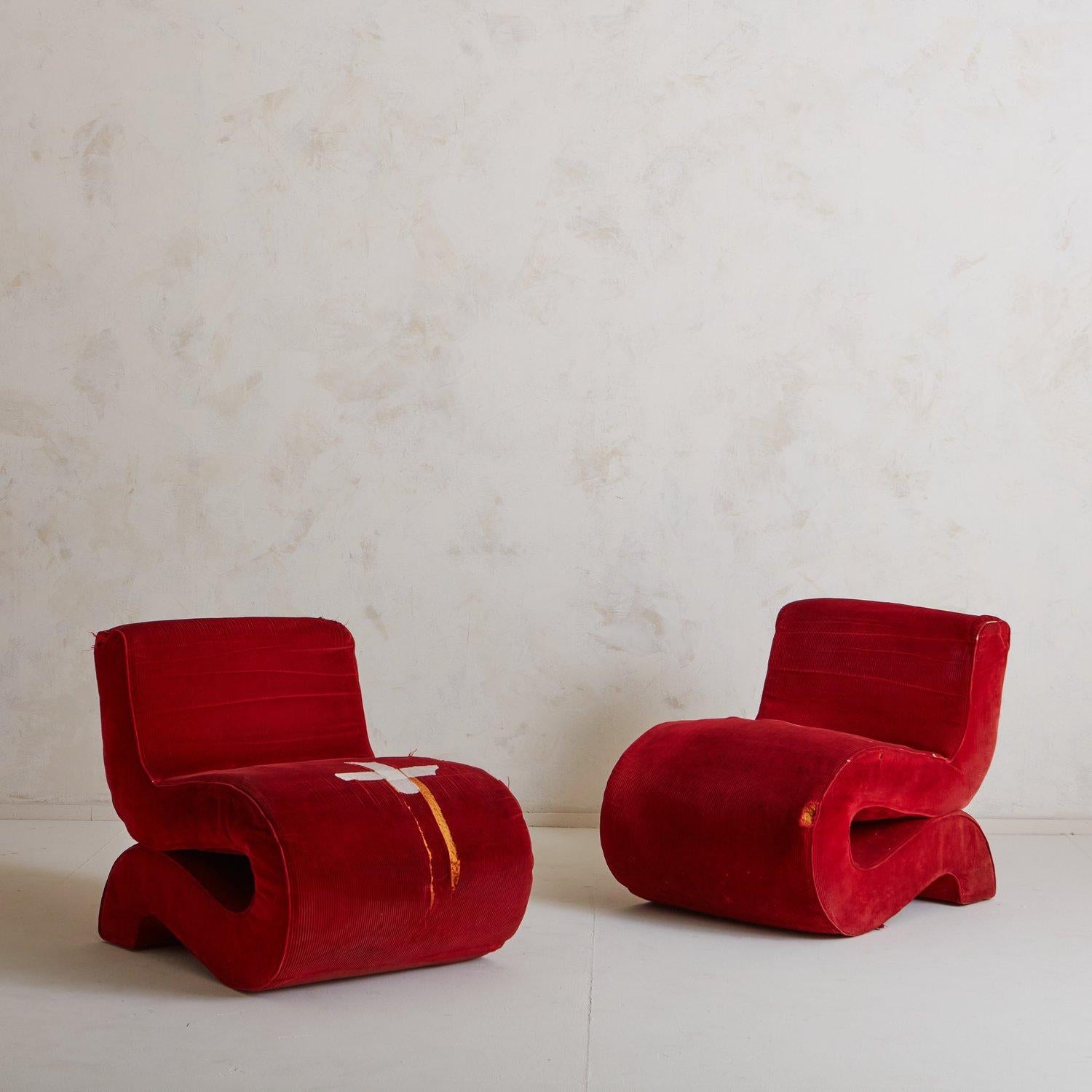 A pair of ‘Noodle’ chairs designed by Augusto Betti for Habitat Faenza in 1967. These chairs feature a unique curved profile and retain their original red corduroy fabric. Unmarked. Sourced in Italy, 1960s.

Augusto Betti (1919-2013) was an