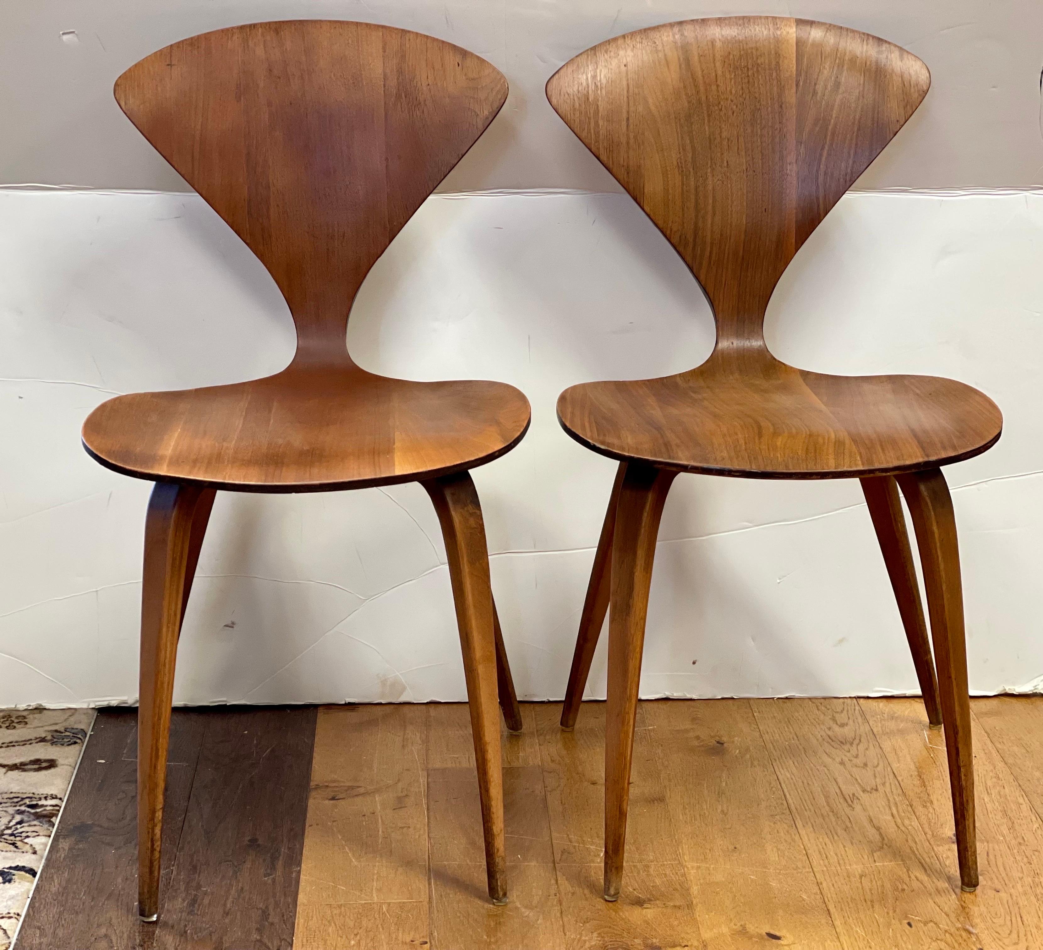 Iconic pair of vintage midcentury Norman Cherner chairs. They have normal age appropriate wear as they should given their age, almost 65 years old! All dimensions are above. We have a few pairs left and you are bidding on one pair as shown.
