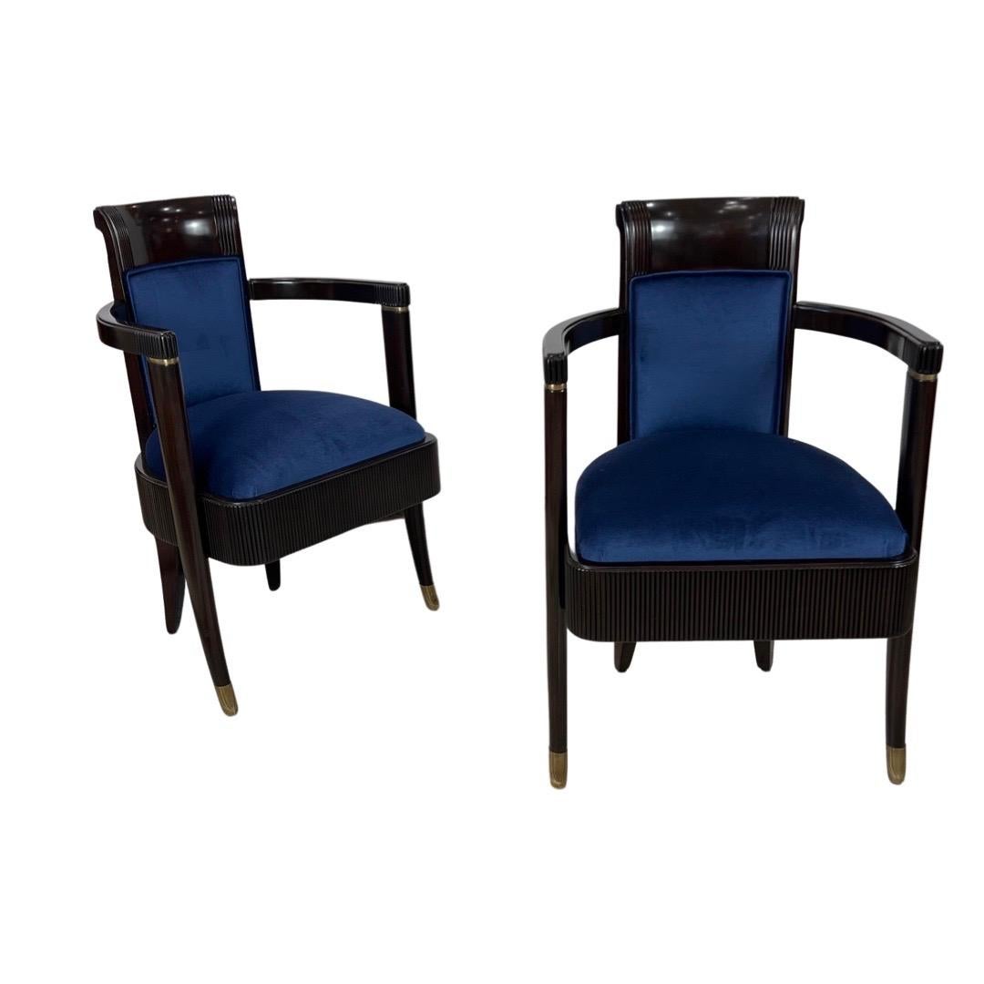These Pair of  Art Deco Mahogany Arm chairs upholstered in Royal Blue Silk Velvet were designed by Pierre Patout to be both functional and beautiful.  They were made for the dinning room of 1st Class of the Compaignne Generale Trasatlantique