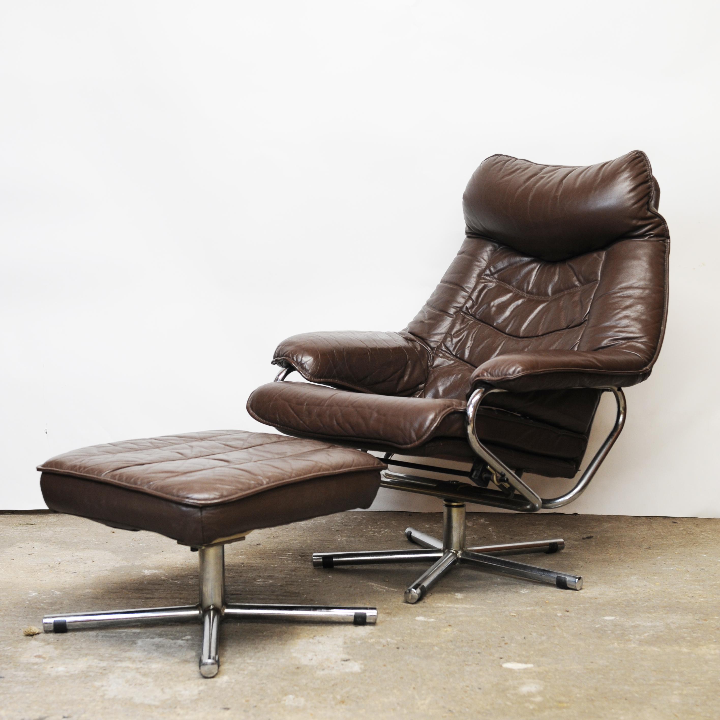 A pair of vintage brown leather lounge chairs with ottomans produced by Skoghaus Industri in Norway. 

Manufacturer - Skoghaus Industri

Design Period - 1970 to 1979

Country of Manufacture - Norway

Style - Mid-Century, Scandinavian

Detailed