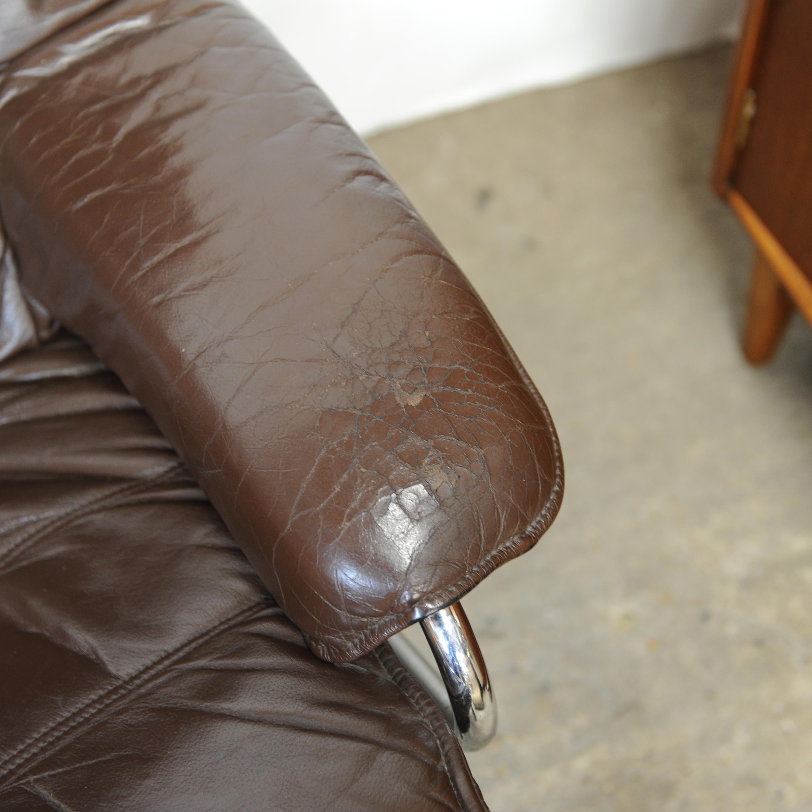 Metal Pair of Norwegian Lounge Chairs with Footstools in Brown Leather by Skoghaus  For Sale