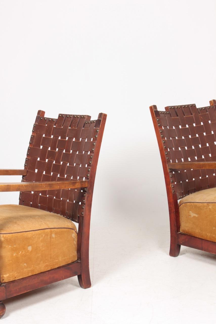 Pair of lounge chairs with a solid wood frame patinated leather and velvet. Designed and made by Møre Lenestolfabrikk A/S Ørstavik. Great original condition.