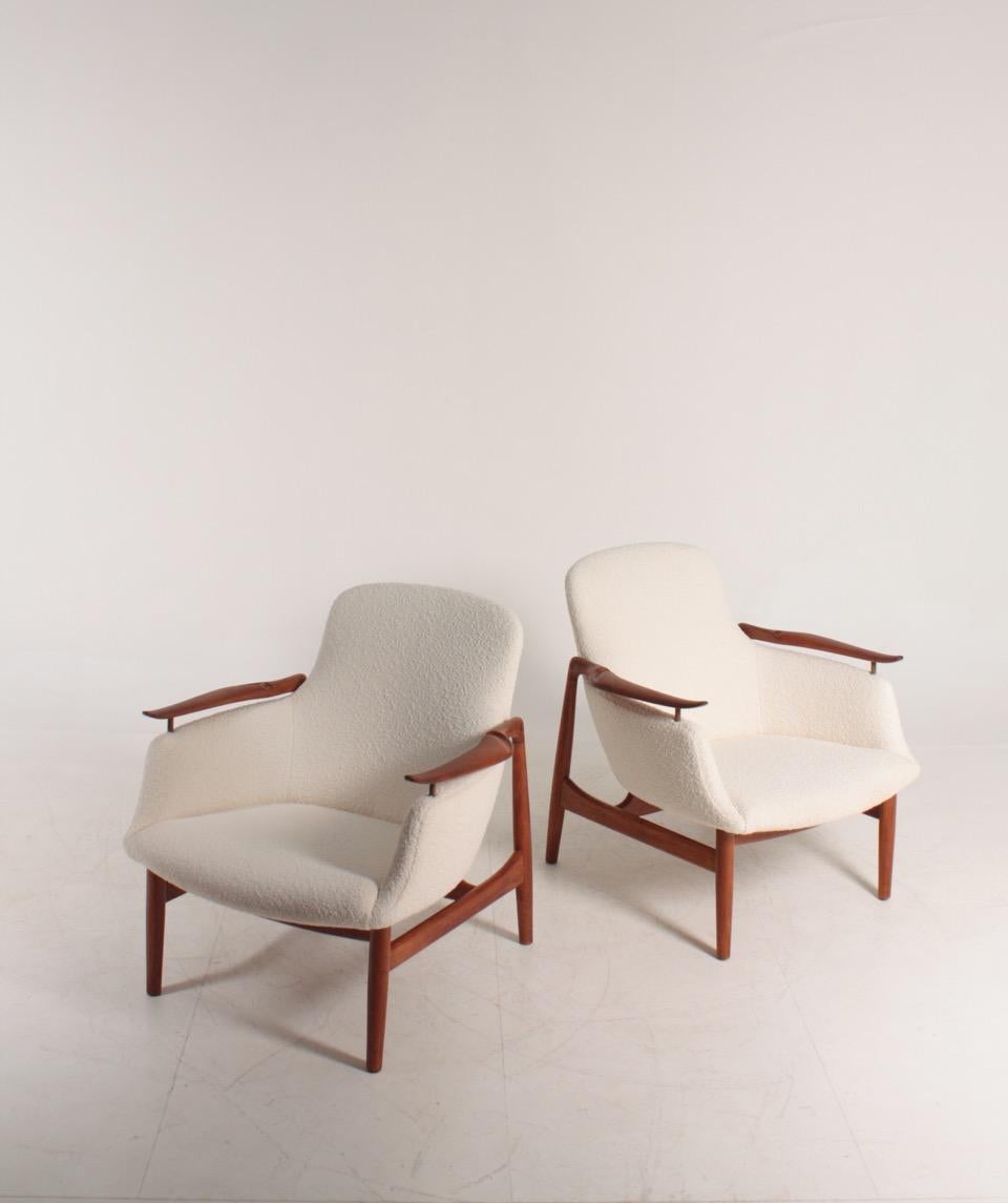 Pair of NV53 lounge chairs in teak and new bouclé, designed by Finn Juhl M.A.A. for Niels Vodder cabinetmakers in 1953. Made in Denmark, Great condition.