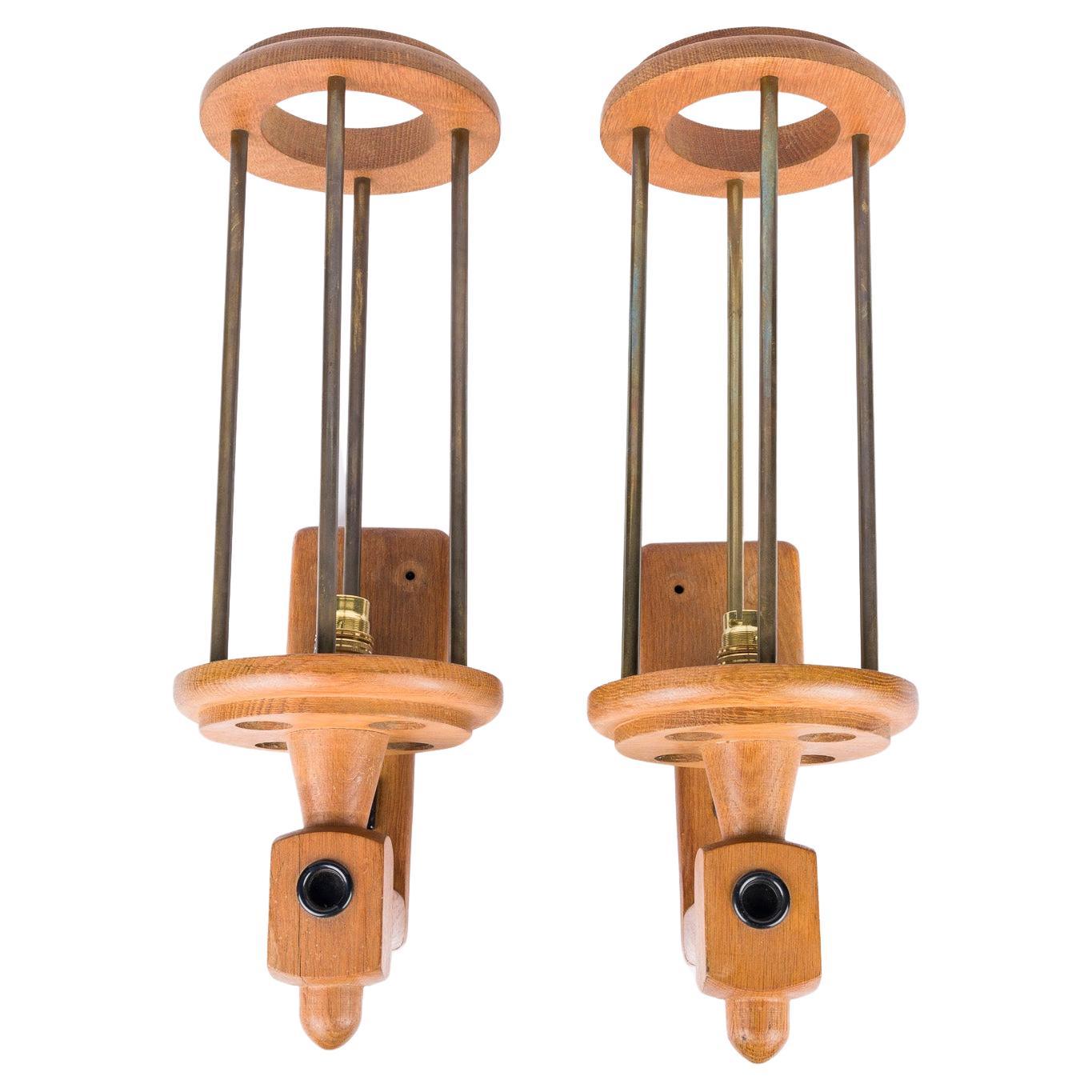 Pair of oak and brass wall lights by Guillerme & Chambron For Sale