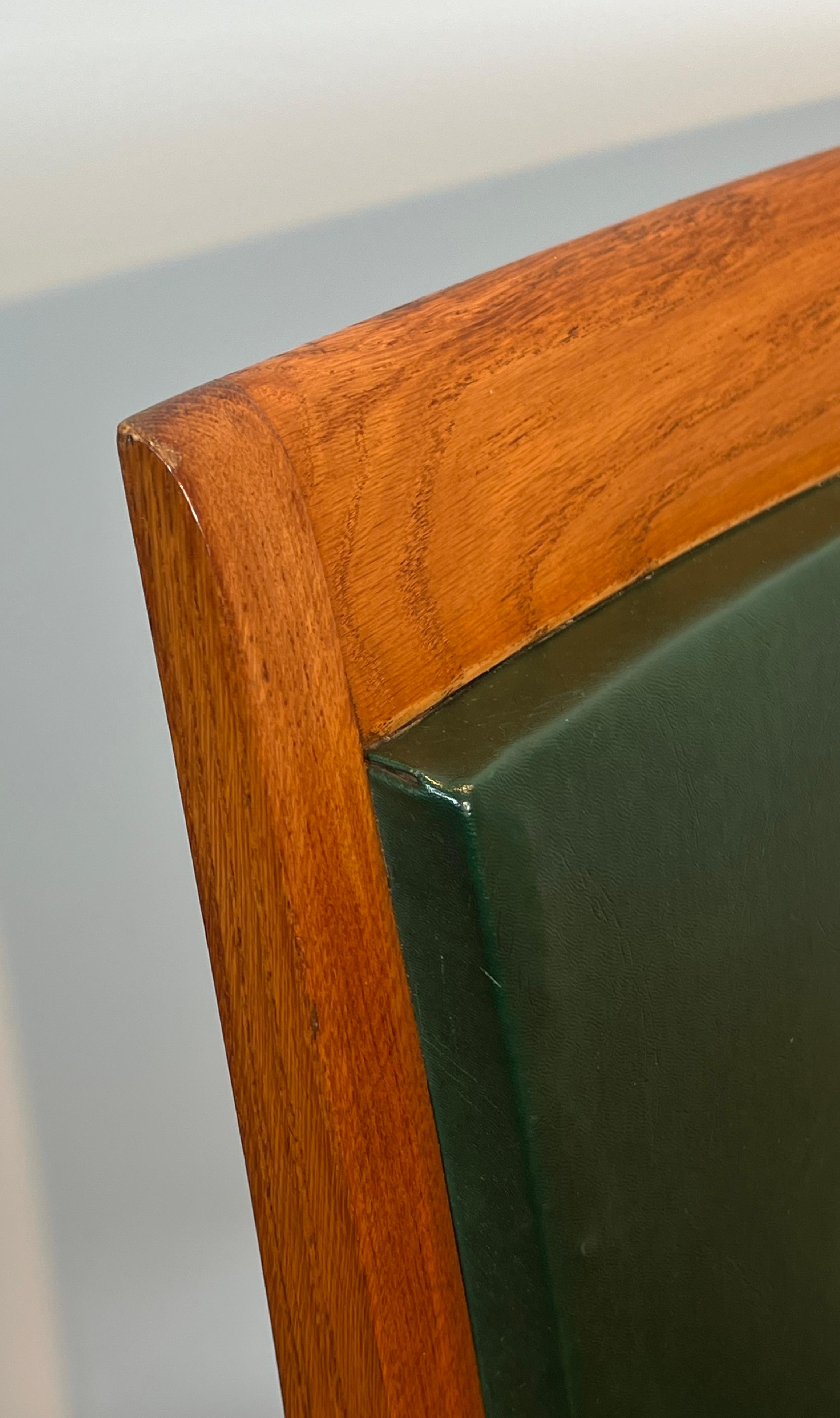 Mid-20th Century Pair of Oak and Leather Armchairs by  De Coene Frères For Sale