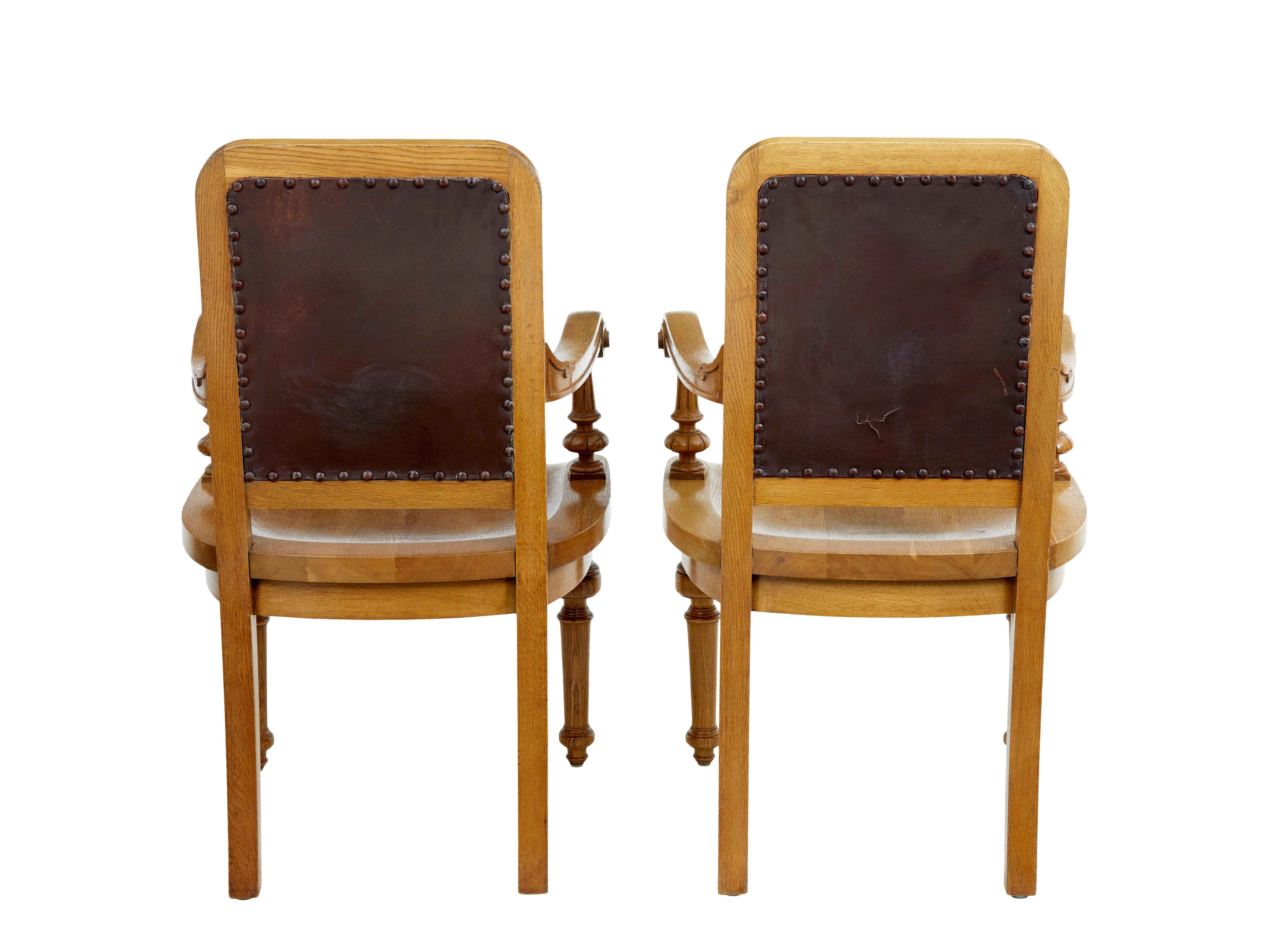 Pair of oak and leather arts and crafts library chairs 2