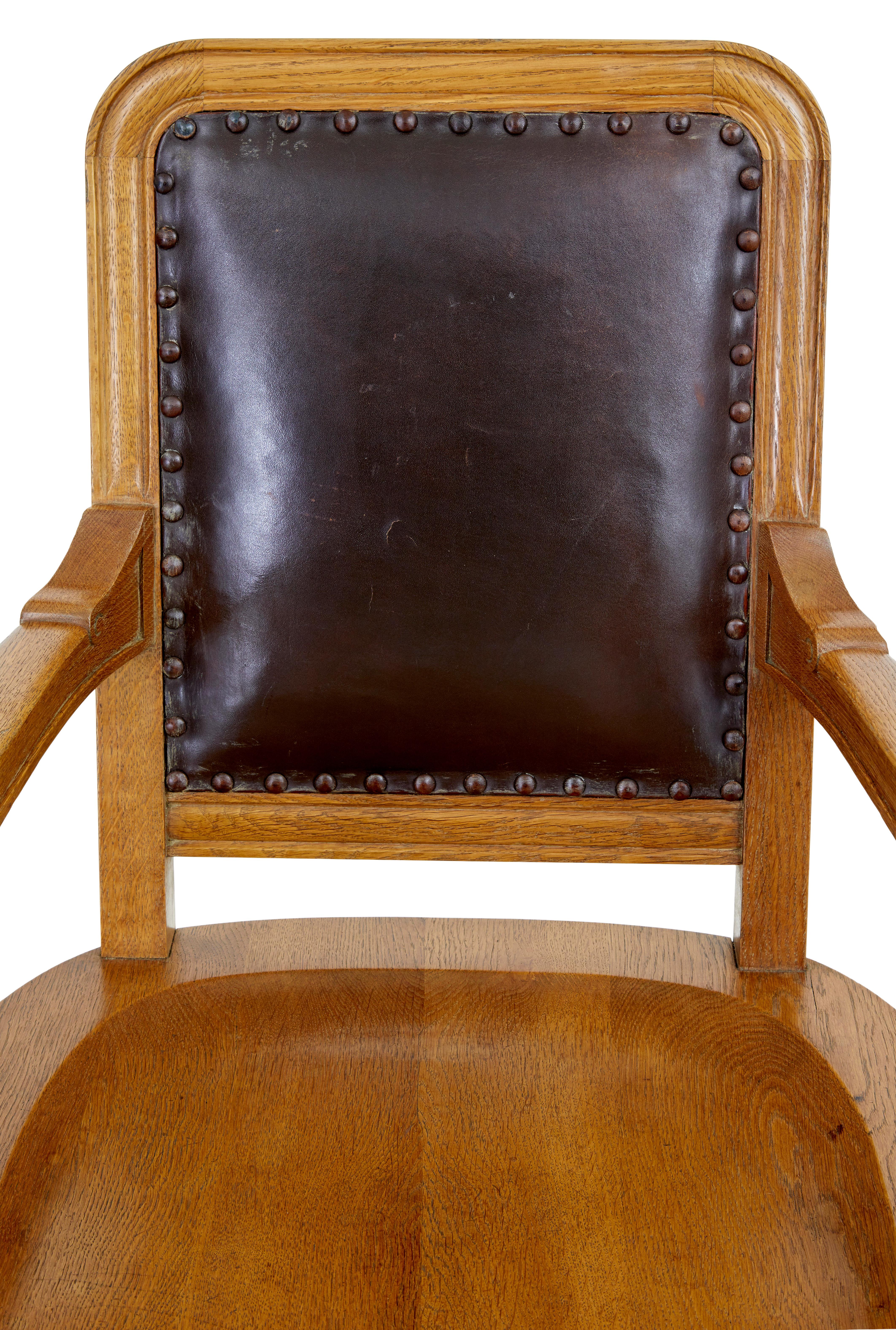 English Pair of oak and leather arts and crafts library chairs