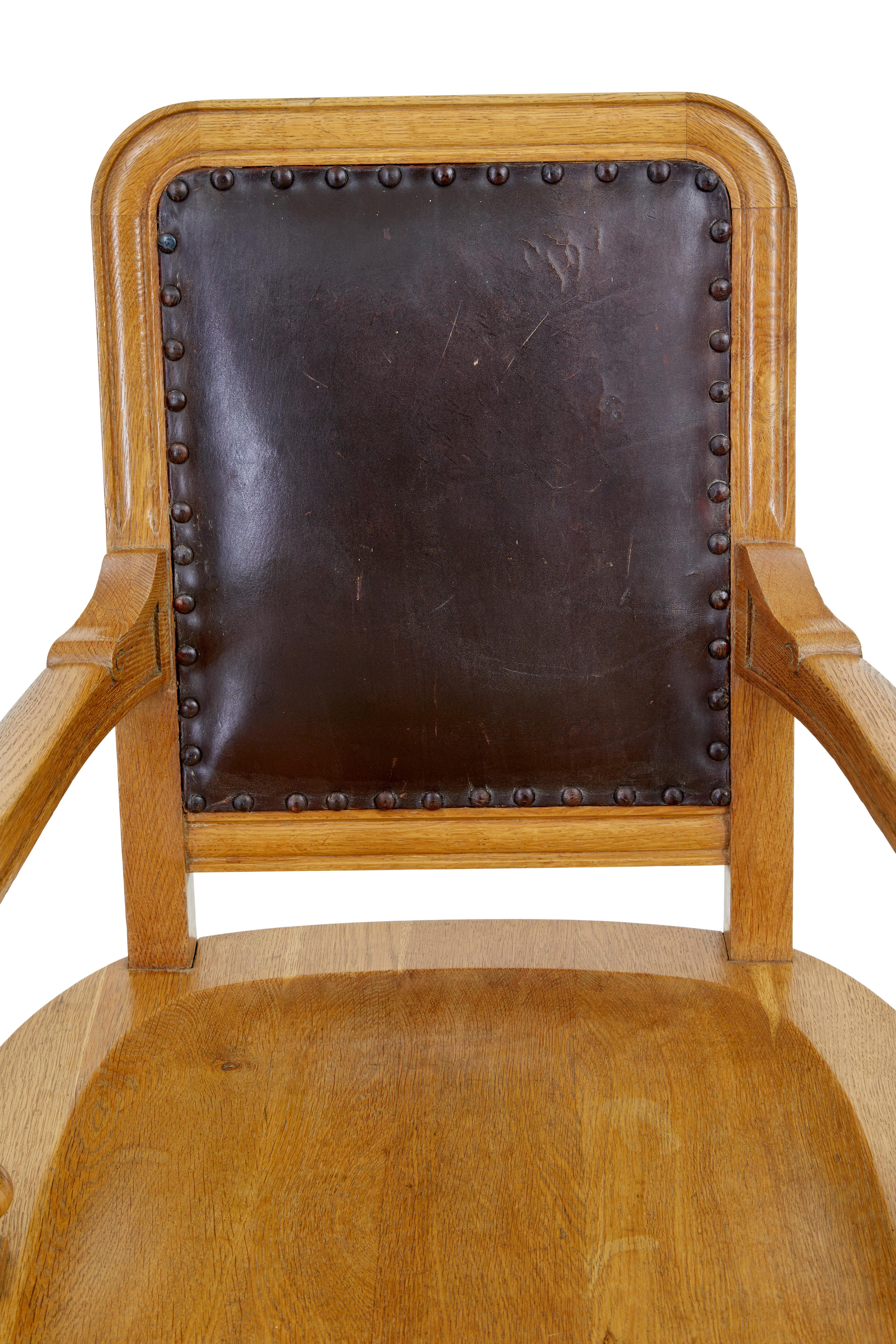 Carved Pair of oak and leather arts and crafts library chairs