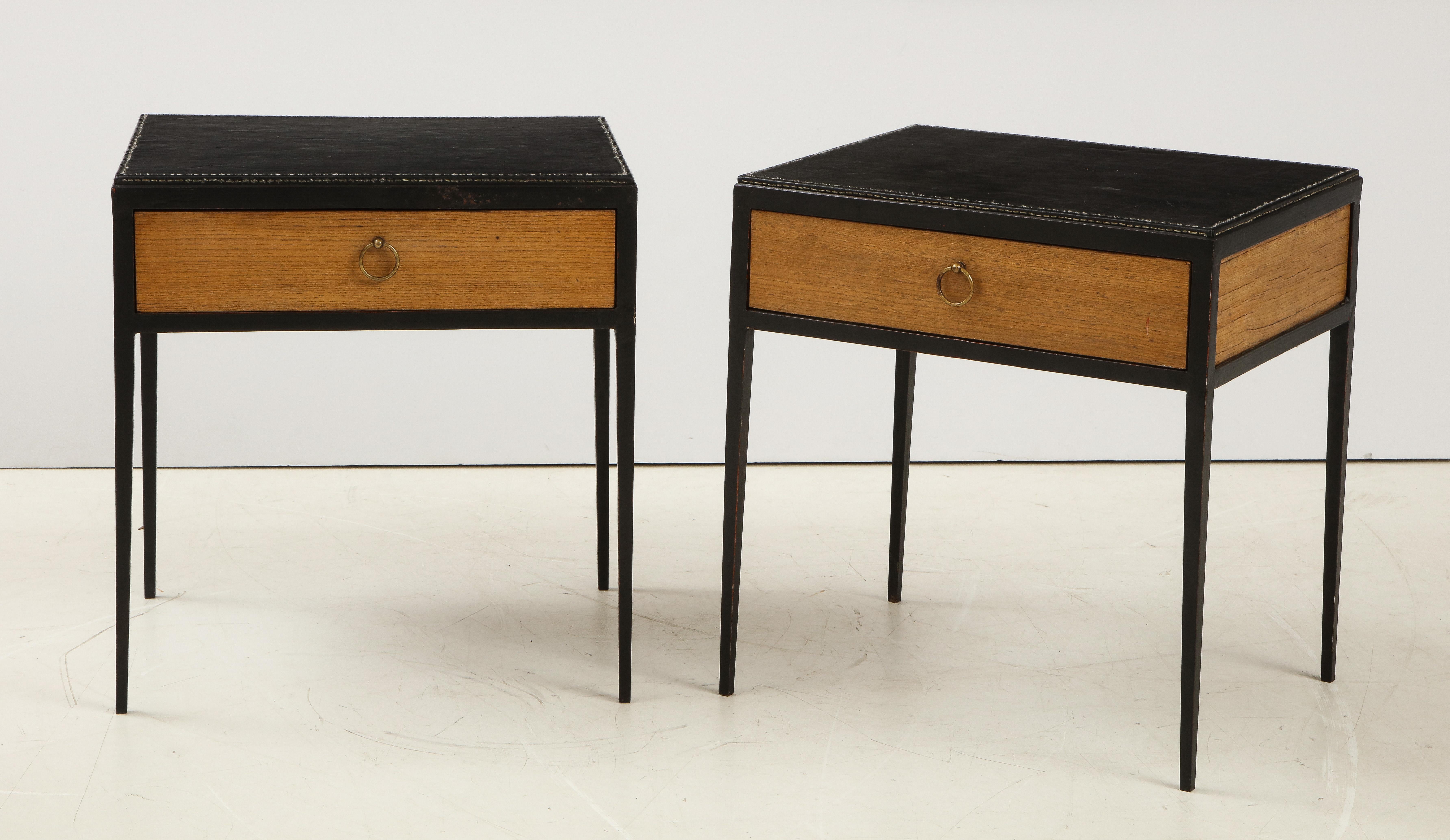 Pair of oak side tables inset with a stitched leather top in the manner of Jean Michel Frank.