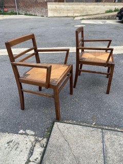 Paire de fauteuils en chêne et paille " René Gabriel