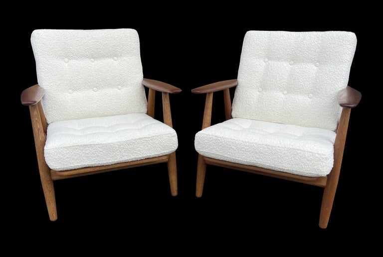 These are a particularly good original pair of Wegner Cigar chairs, all original apart from the covers on the cushions, which retain the original interiors, so feel as they should to sit in, but with fresh new high quality boucle fabric covers.