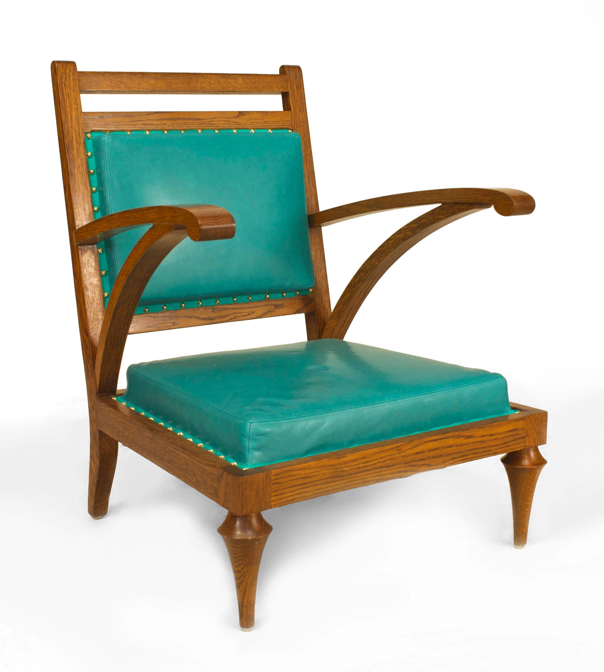 Pair of Post-War (modern) oak slipper form Armchairs with turquoise leather upholstered seat and back
