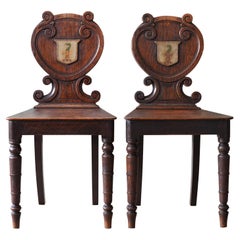 Pareja de sillones de salón con brazos de roble