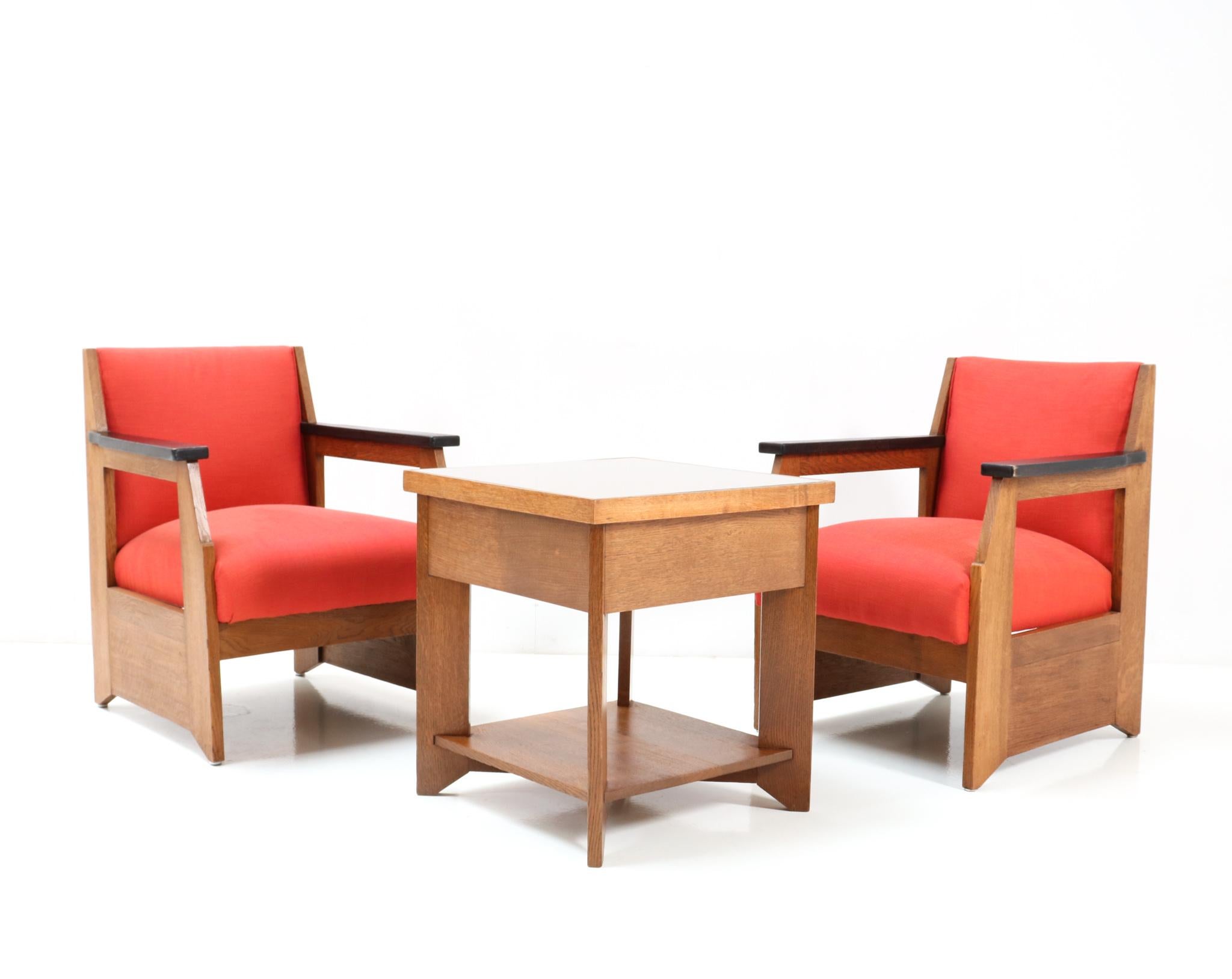Magnificent and rare pair of Art Deco Modernist easy chairs.
Design by Hendrik Wouda for H. Pander & Zonen Den Haag.
Striking Dutch design from 1924.
Solid oak frames with original black lacquered armrests.
Re-upholstered with cotton