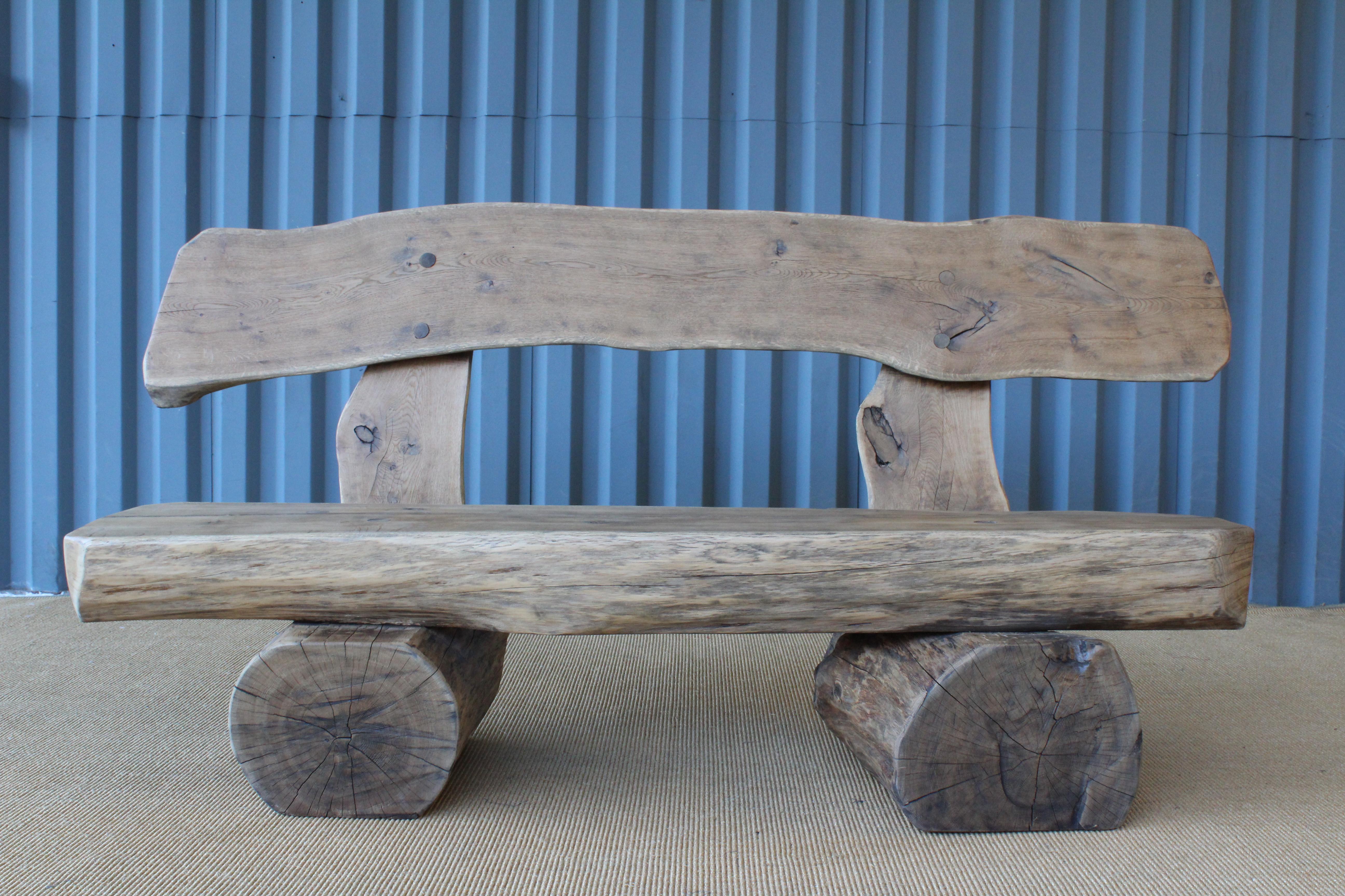 Pair of rustic solid oak benches made in France in the 1960s. The pair have been lightly refinished and still show a wonderful patina. Suitable for indoor or outdoor use. Pair available, sold individually.
 