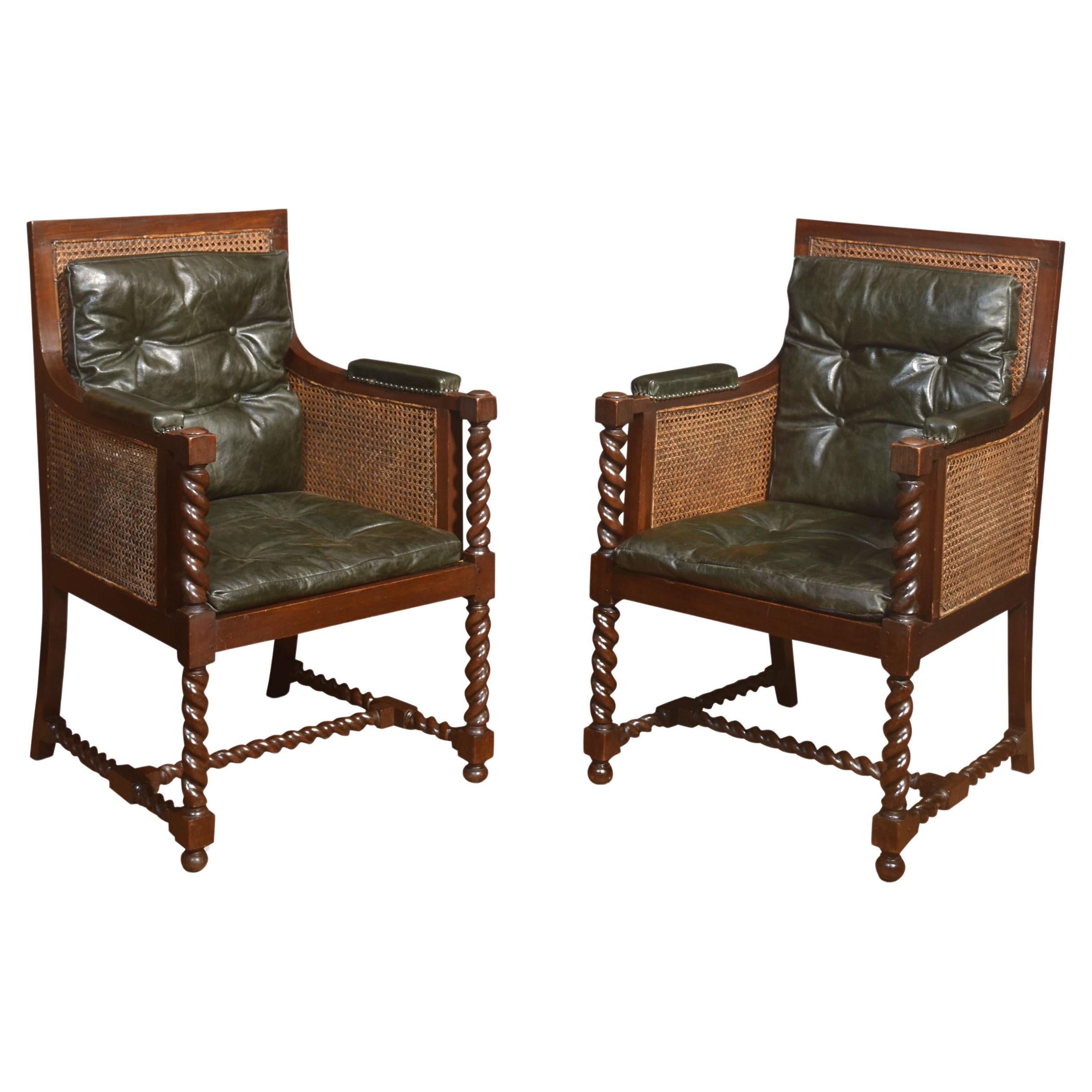 Pair of oak bergere library chairs For Sale