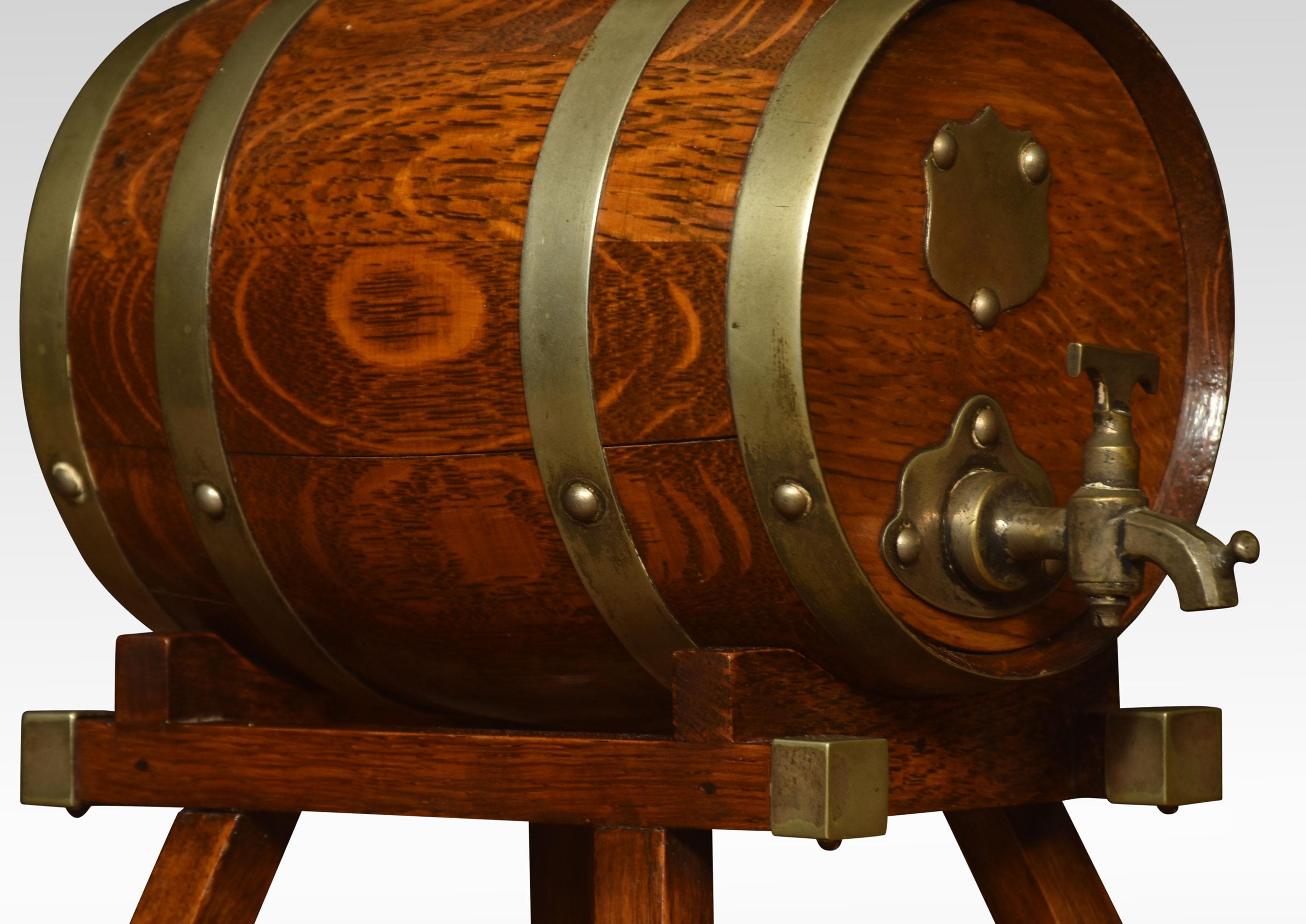 Pair of coopered oak spirit barrels the brass bindings with silver plated mounts, raised up on stylised bases, having stoneware pottery linings.
Dimensions
height 10 inches
width 6.5 inches
depth 9.5 inches